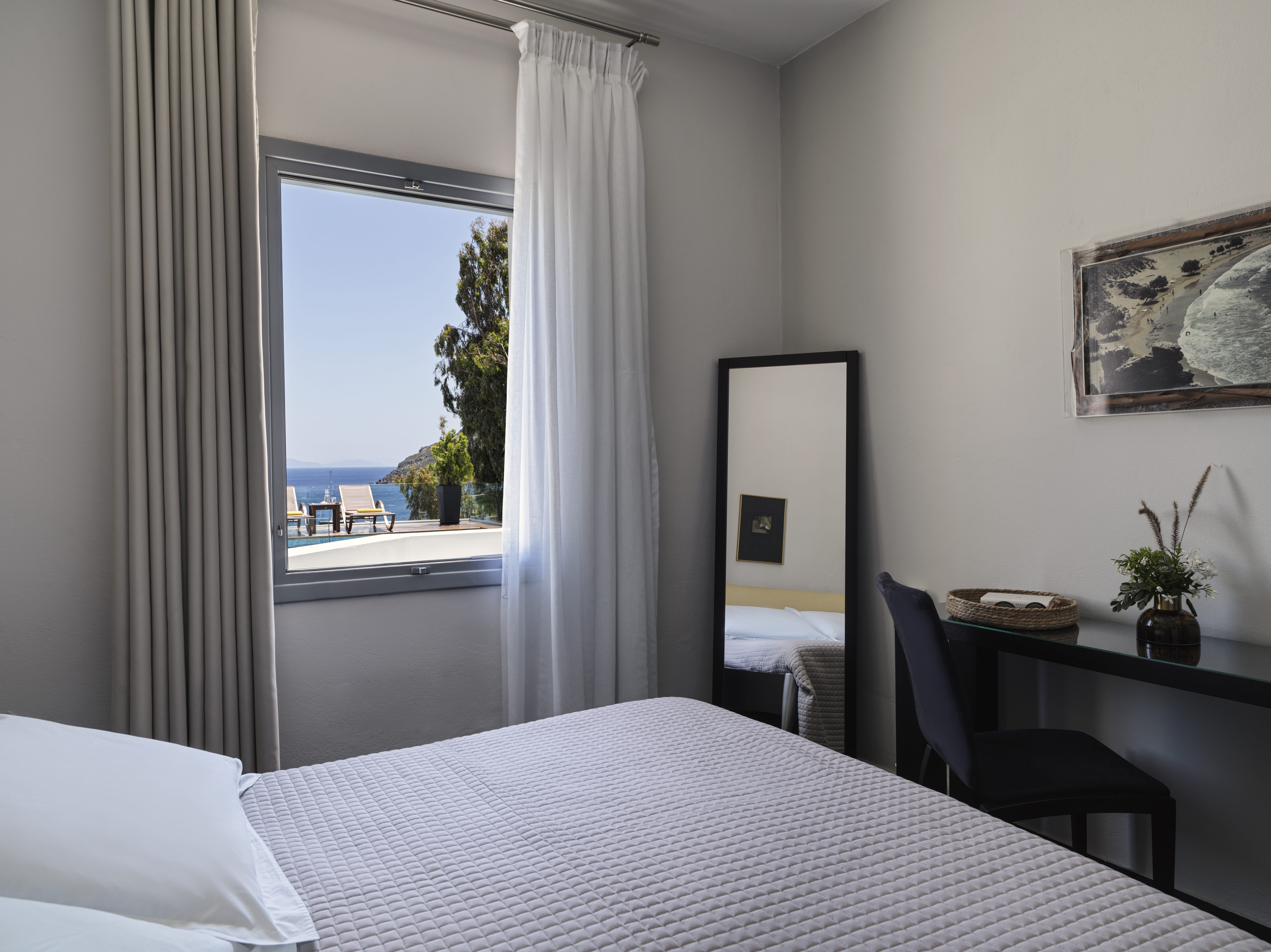 a bedroom with a large window