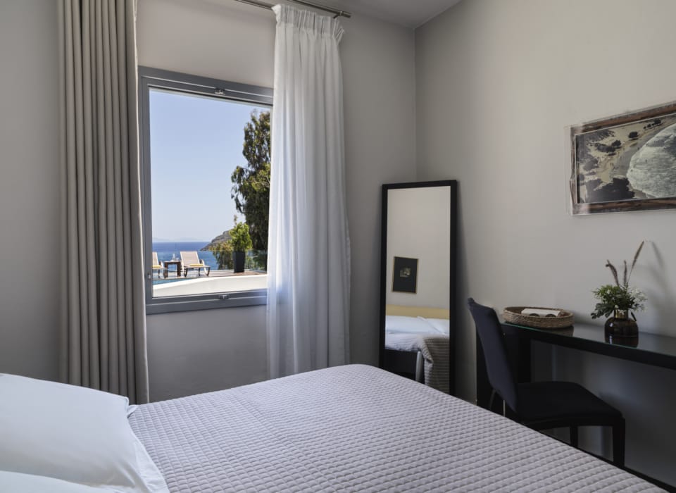 a bedroom with a large window