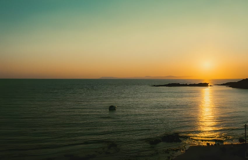 a sunset over a body of water