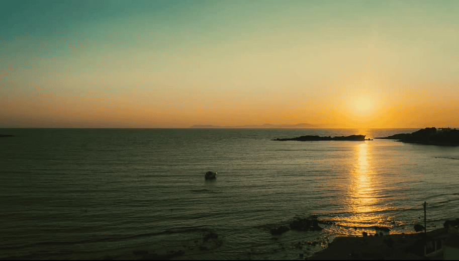 a sunset over a body of water