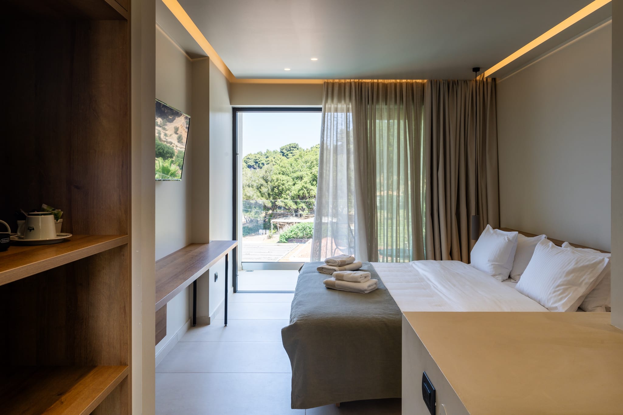 a bedroom with a large window