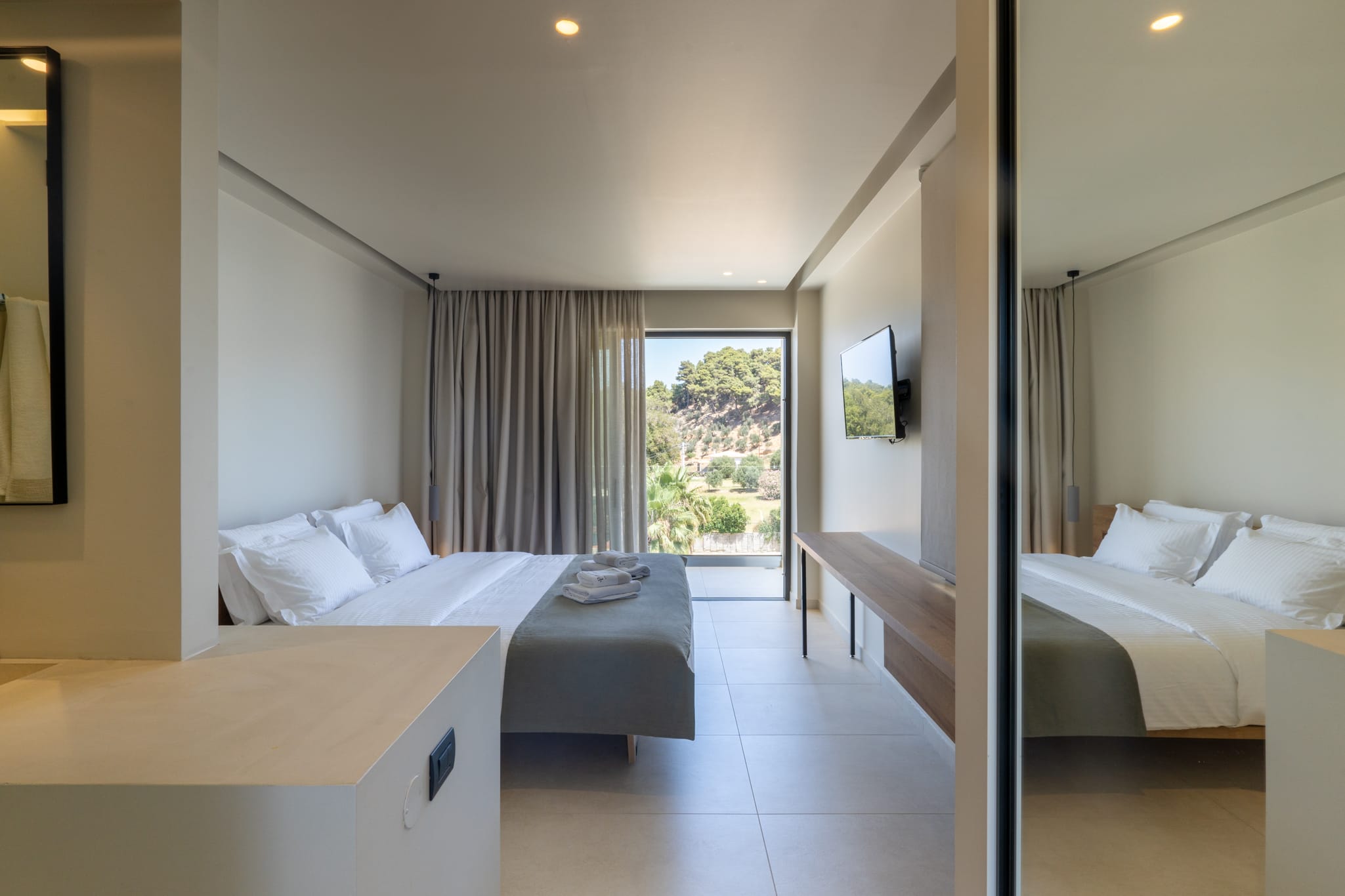 a bedroom with a bed and a desk