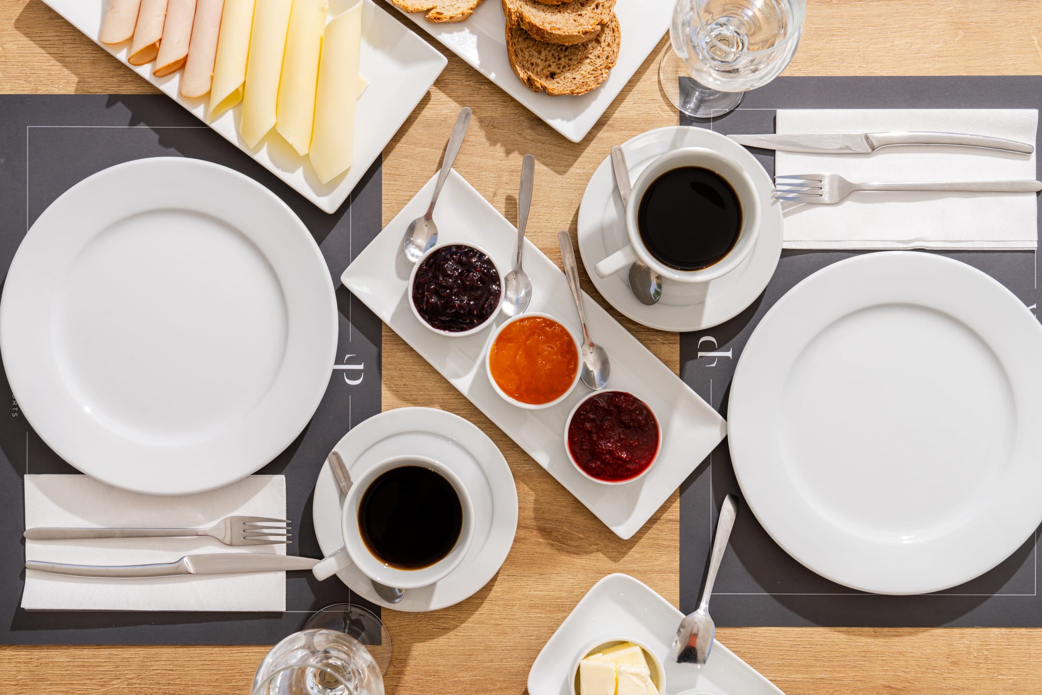 a table with plates and plates of food