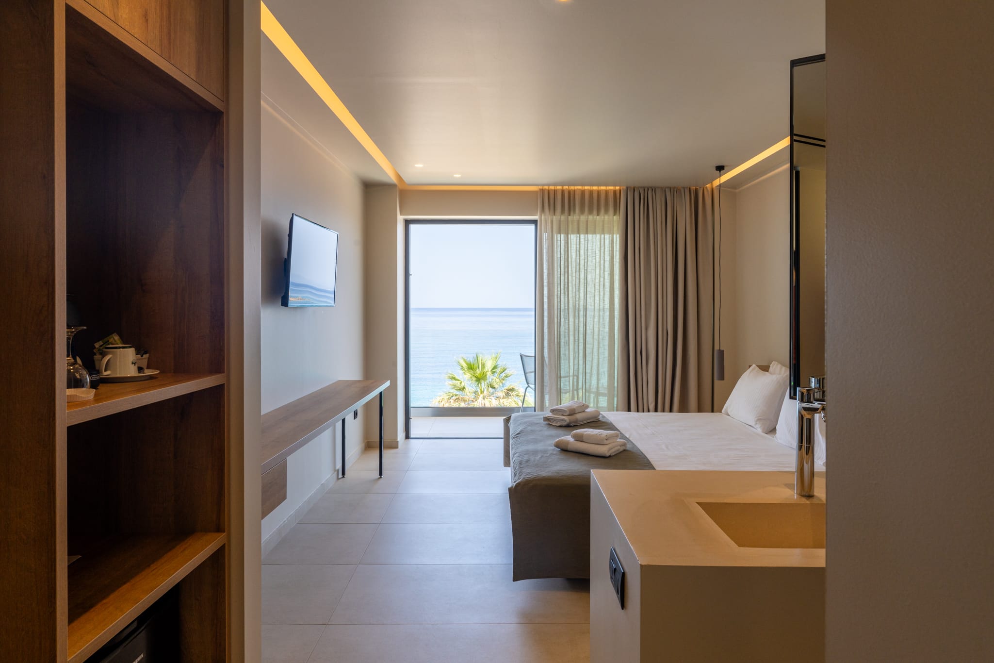 a room with a bed and a sink