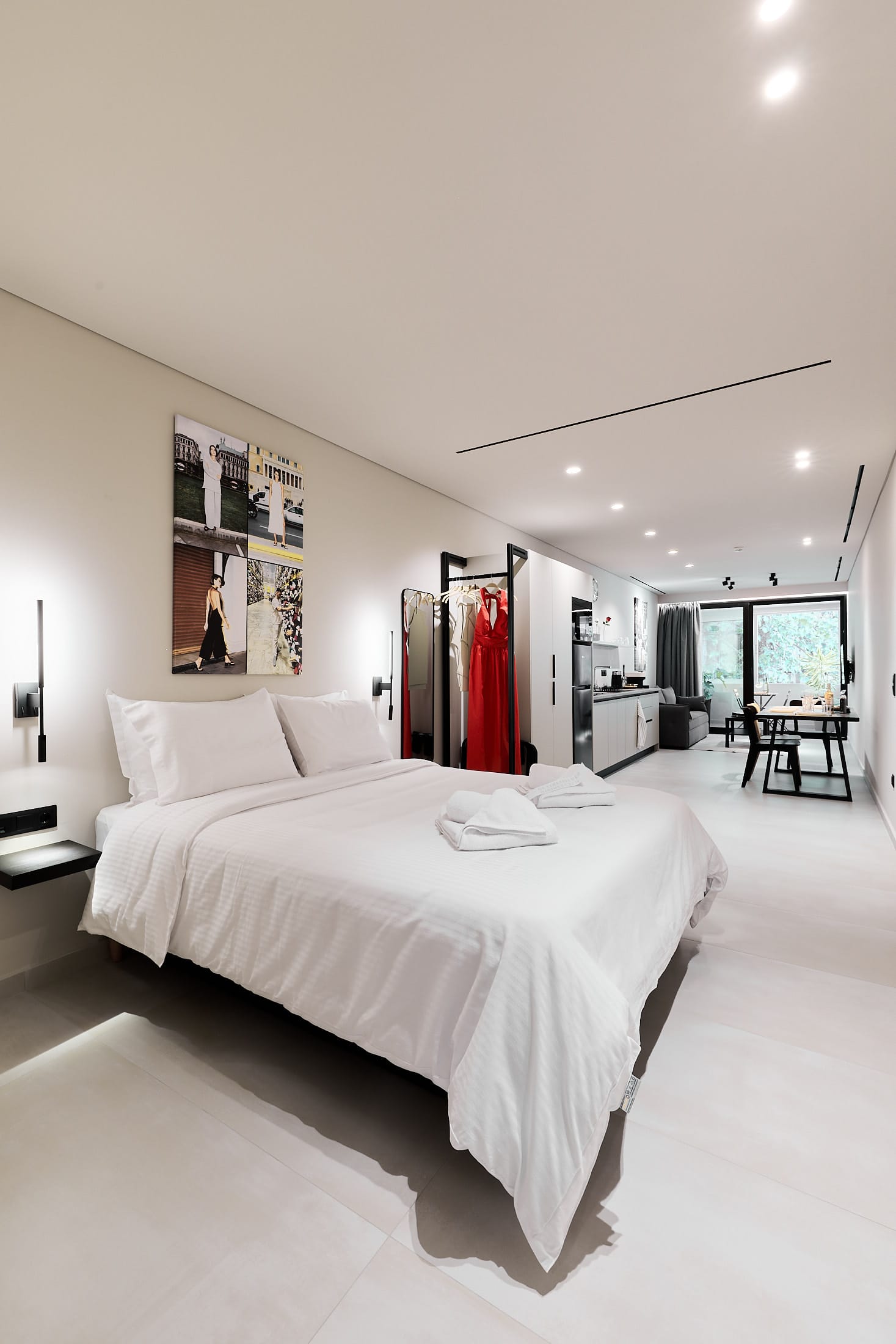 a bedroom with a bed and a mirror