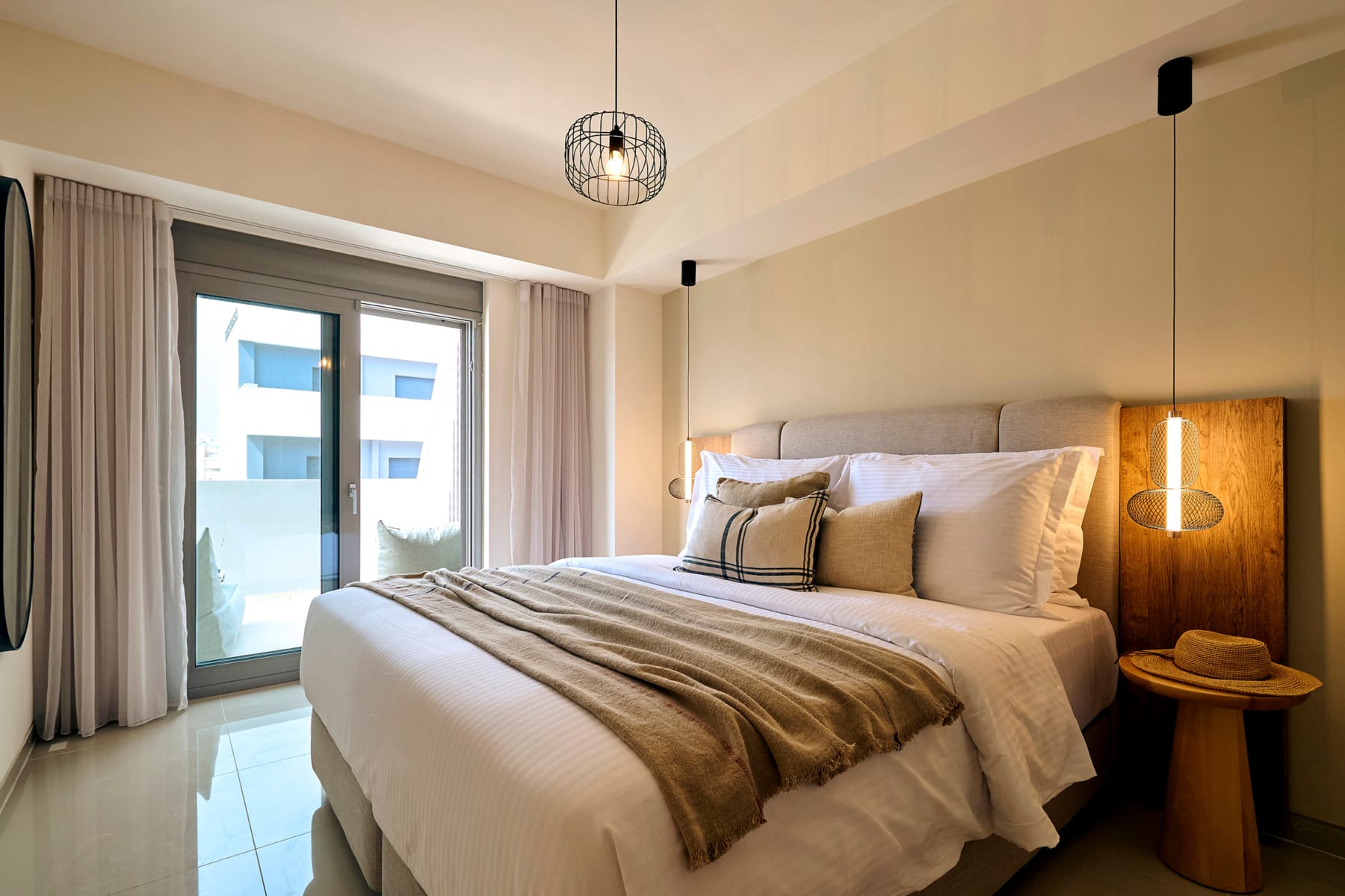 a bed with a light from the ceiling