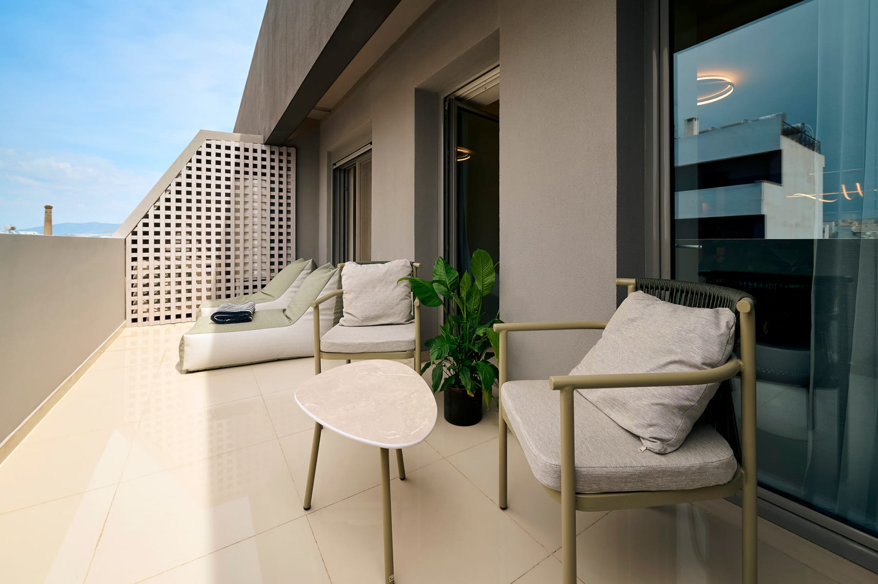 a patio with chairs and a table