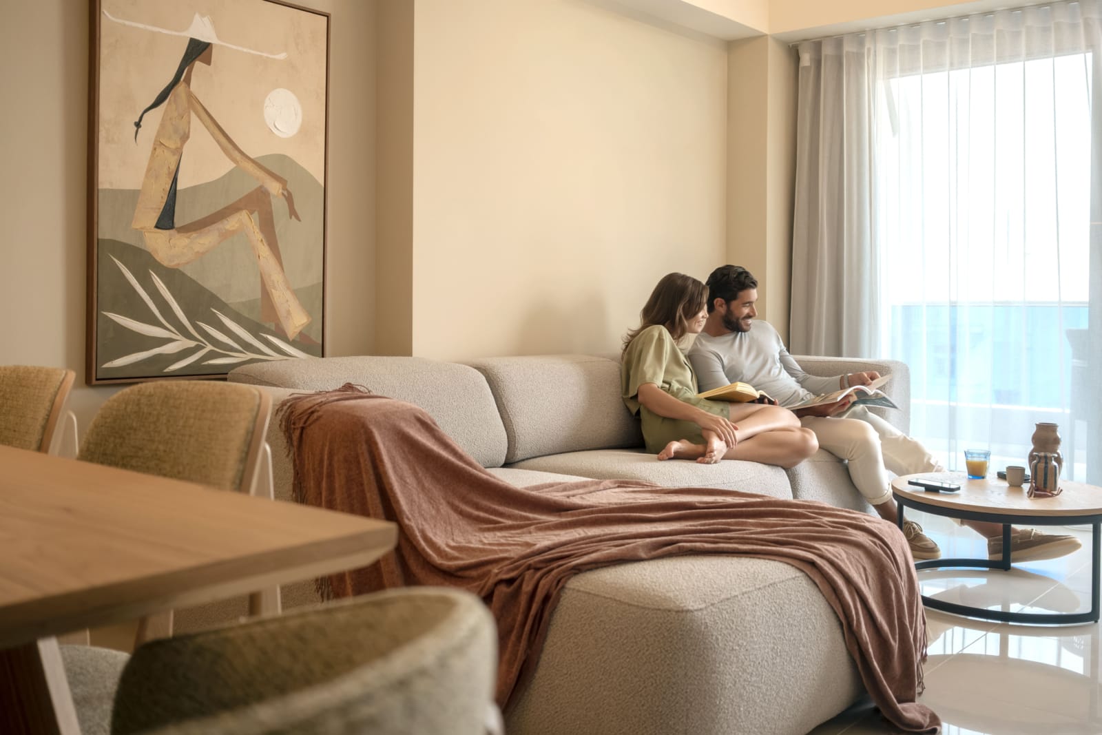 a couple sitting on a couch