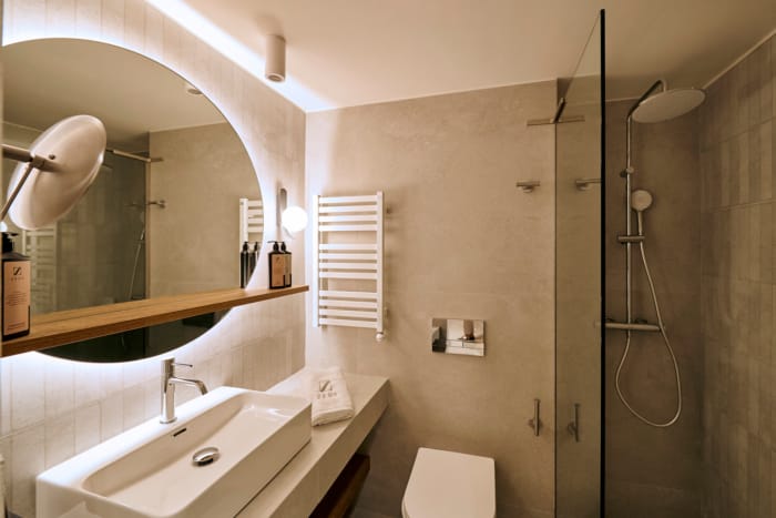 a bathroom with a mirror and sink