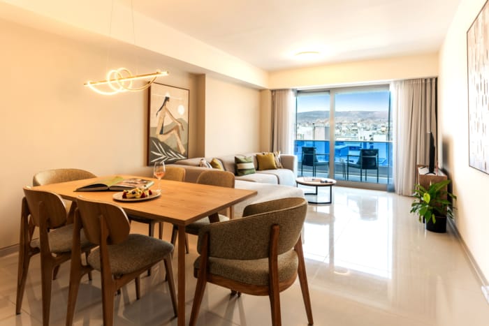 a living room with a table and chairs