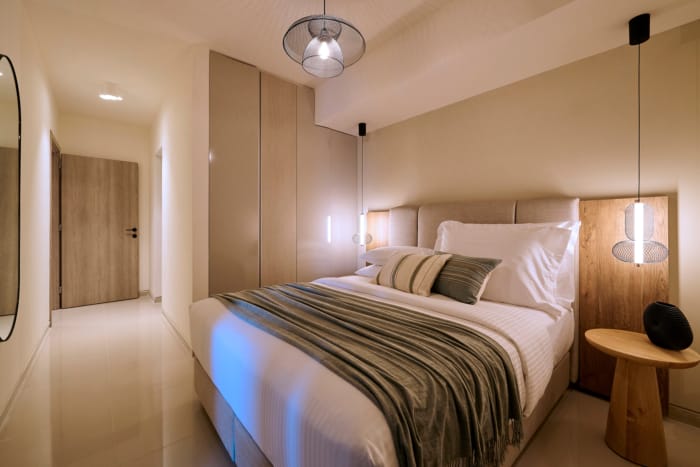 a bed with a light on the side