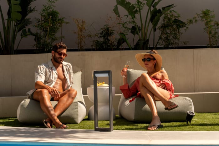 a person and person sitting on bean bags