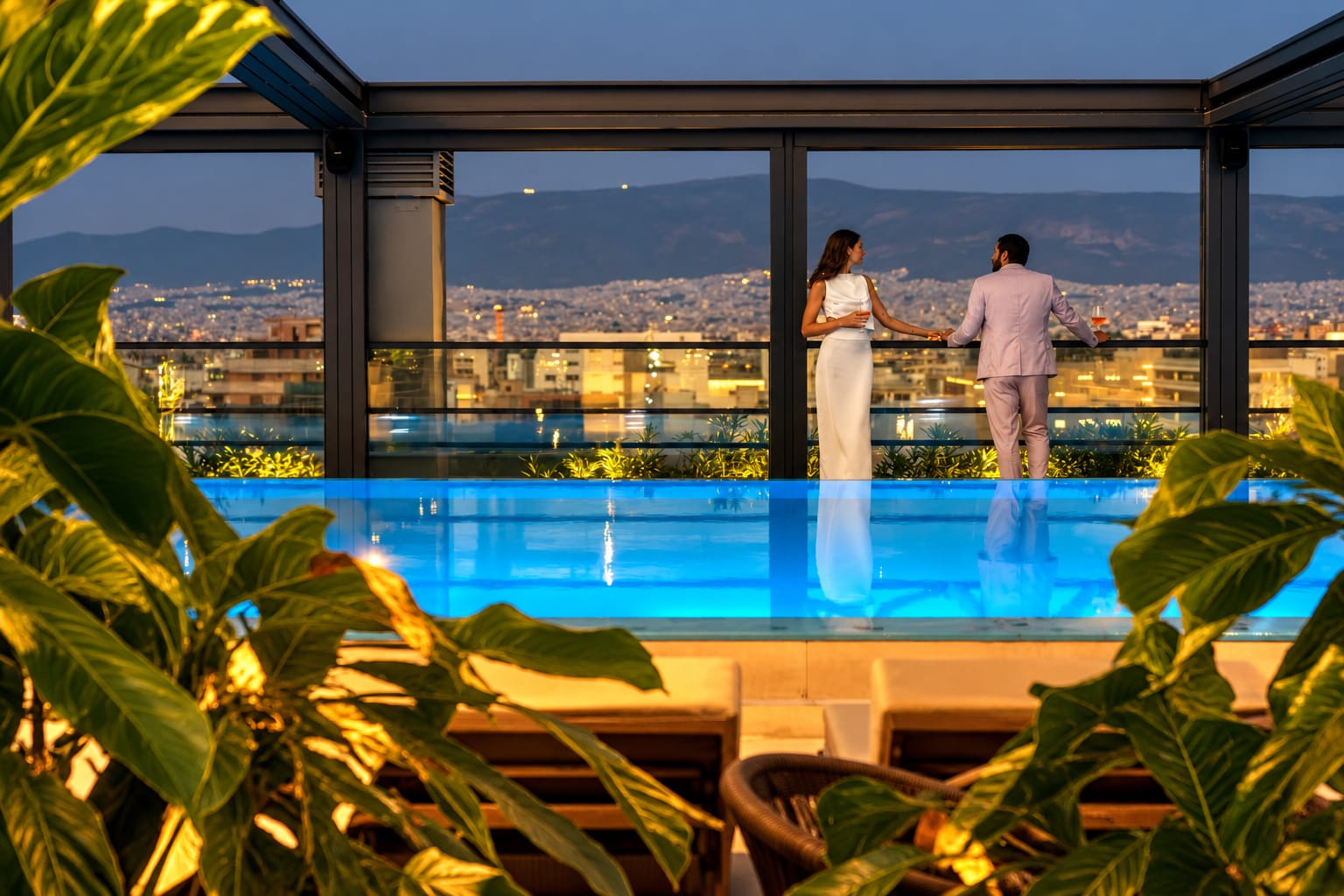 a person and person standing on a rooftop overlooking a city