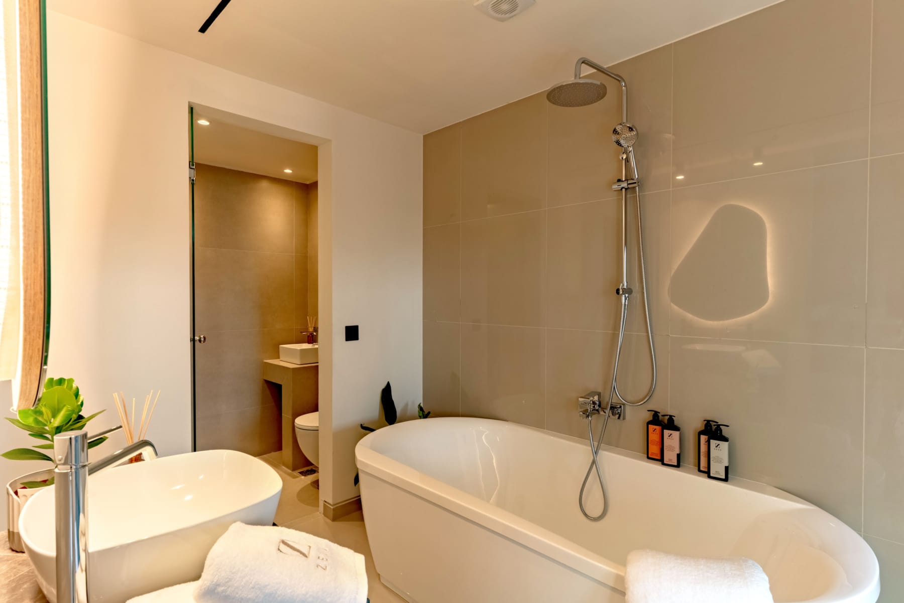 a bathroom with a tub and toilet