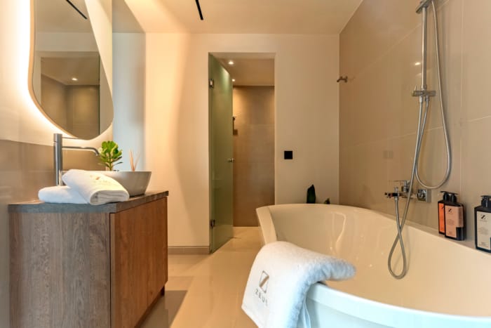 a bathroom with a bathtub and sink
