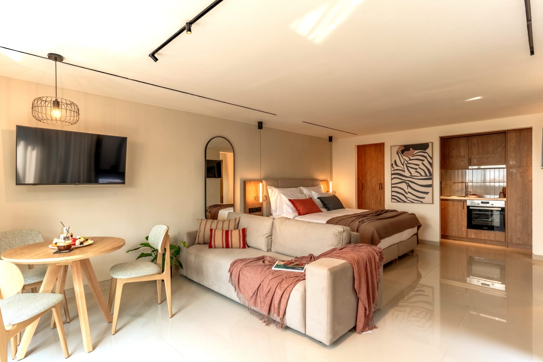 a room with a bed and a tv