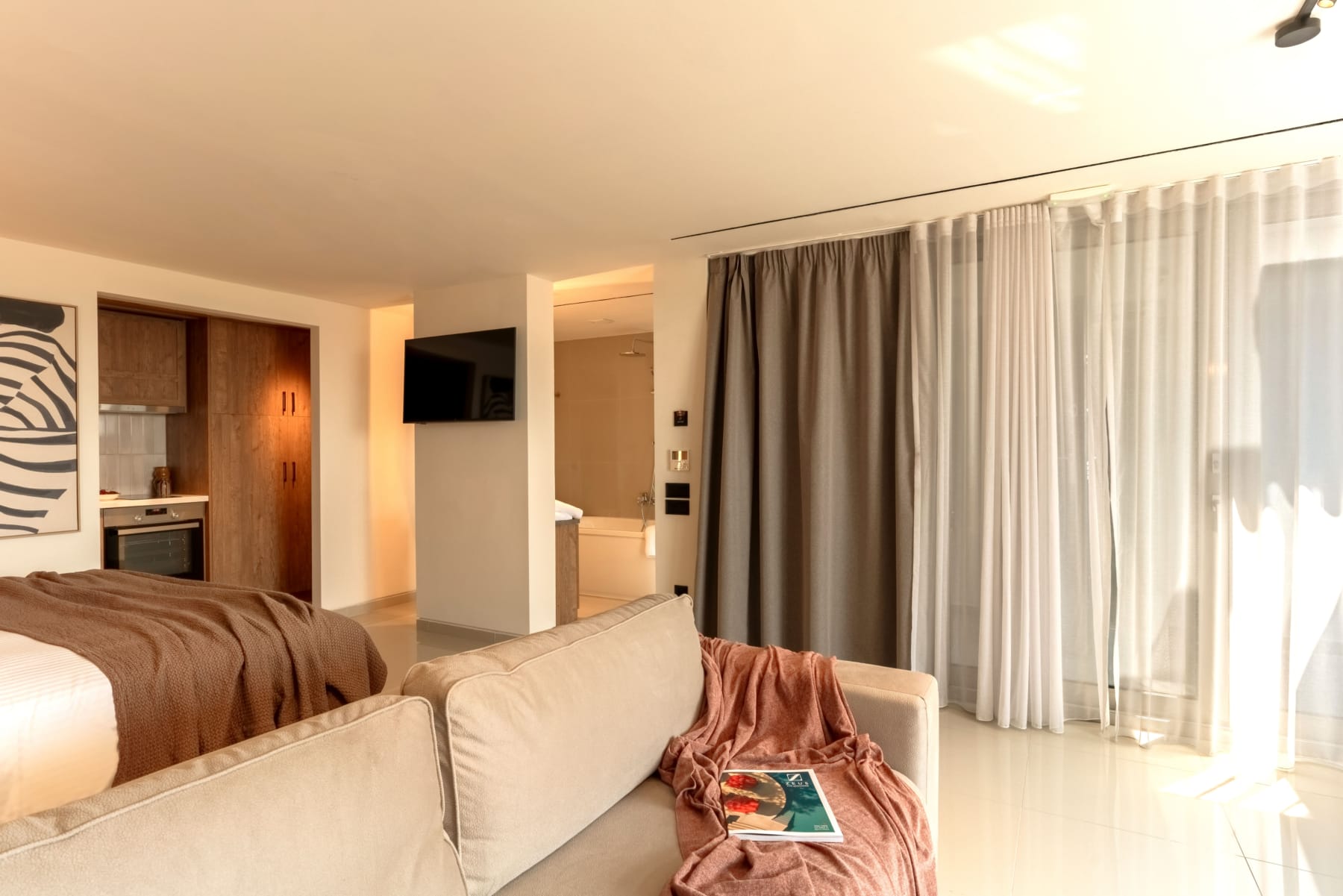 a living room with a couch and a tv