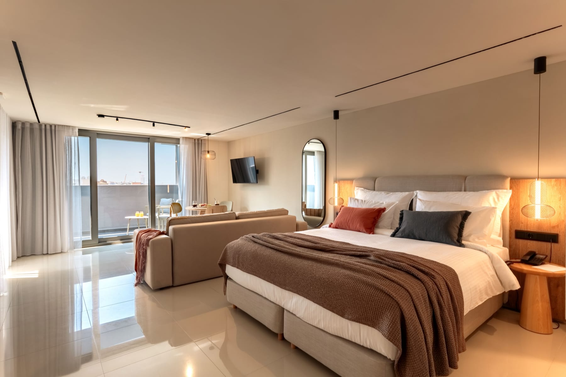 a bedroom with a bed and a television