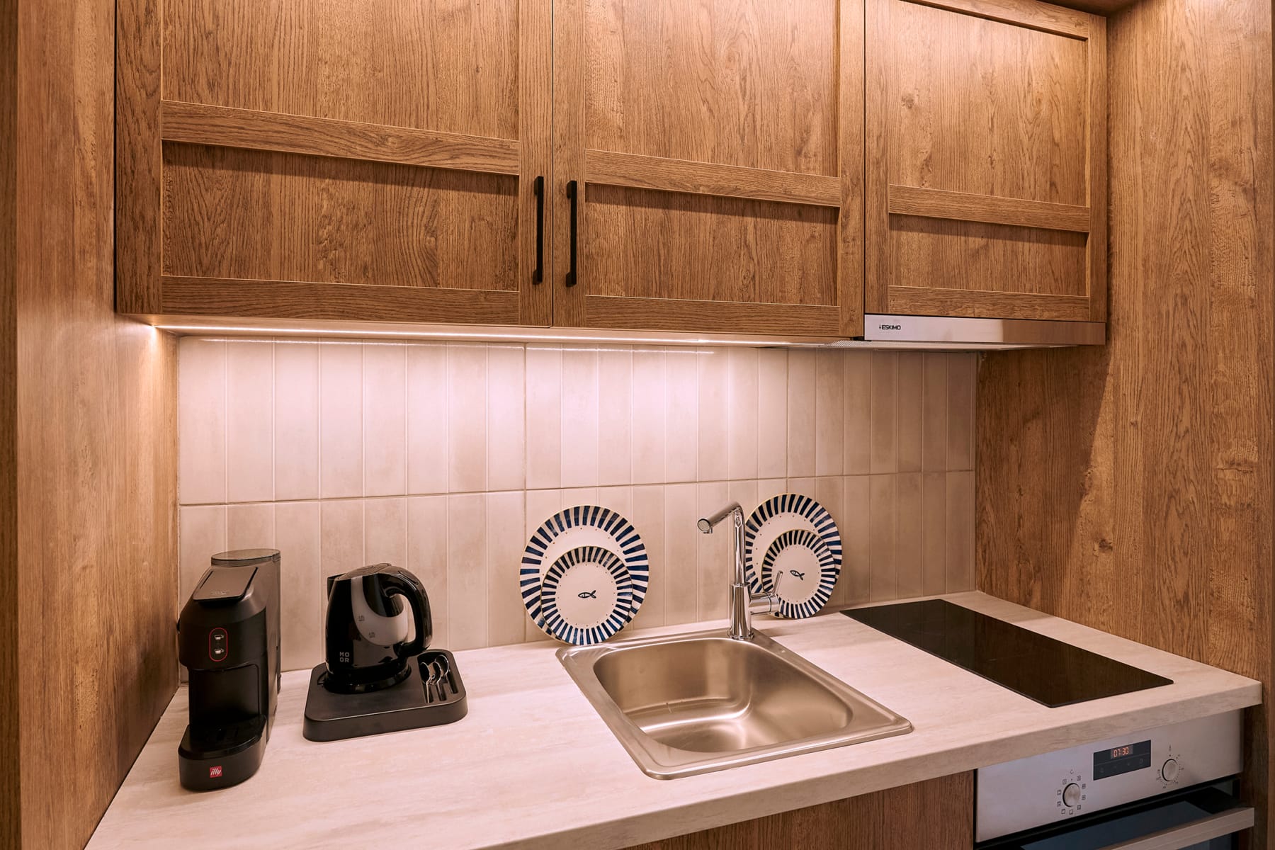 a kitchen with a sink and appliances