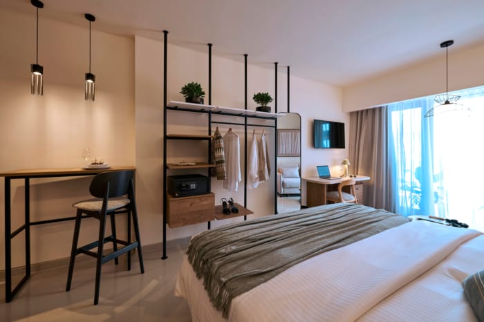 a room with a bed and a desk