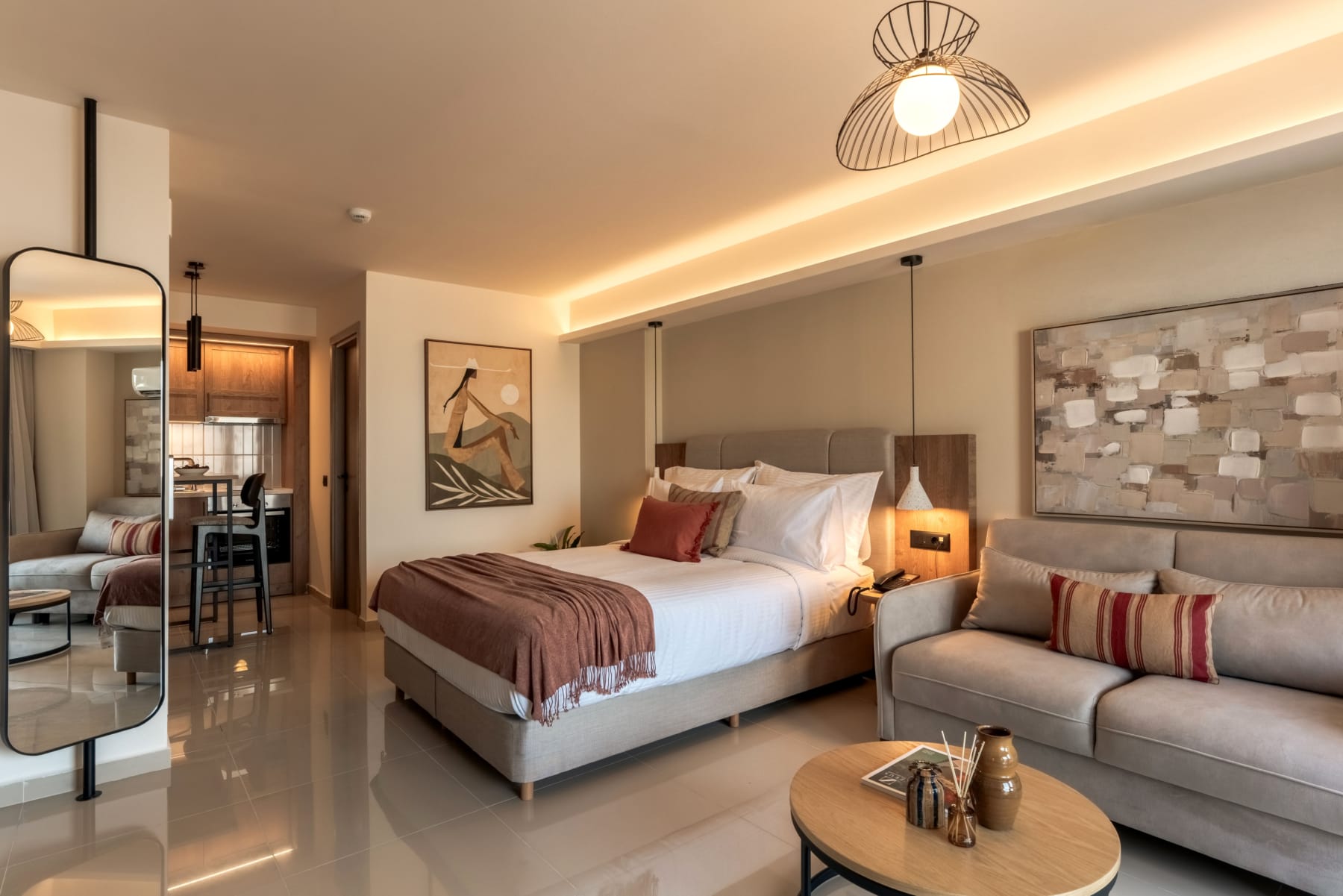 a bedroom with a bed and a couch