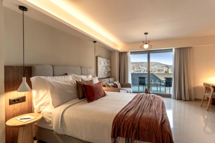 a bedroom with a bed and a balcony