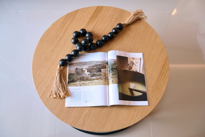 a book and a bead on a table