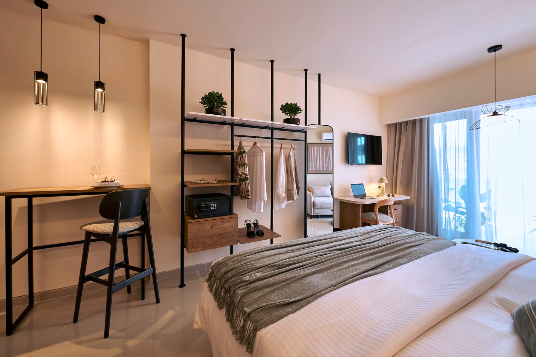 a room with a bed and a desk