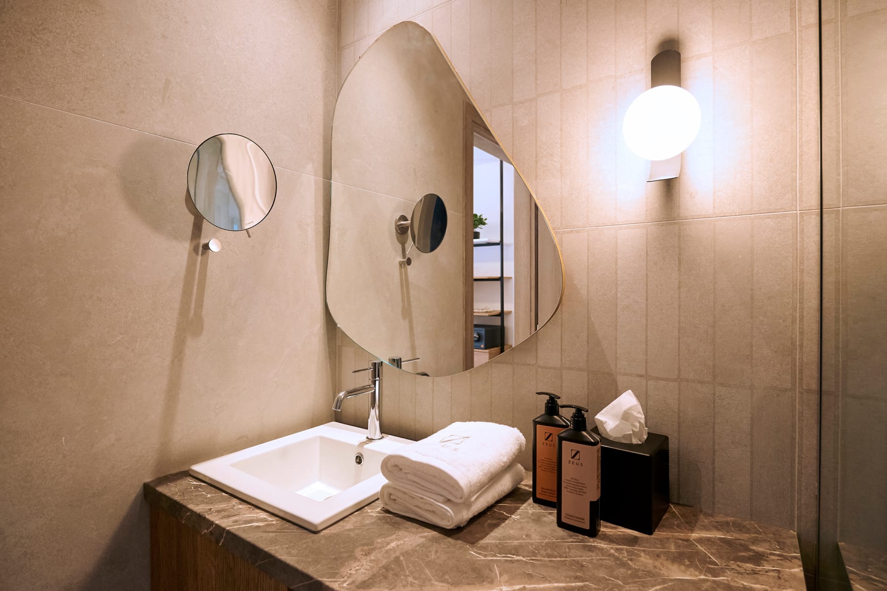 a bathroom with a mirror and sink