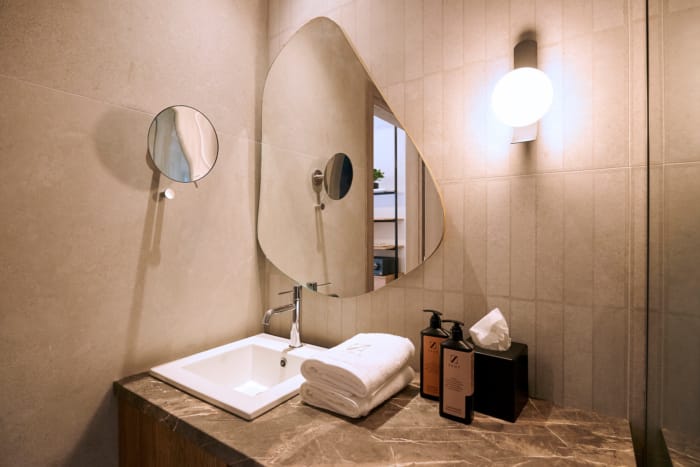 a bathroom with a mirror and sink
