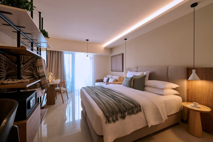 a bedroom with a bed and a bookcase