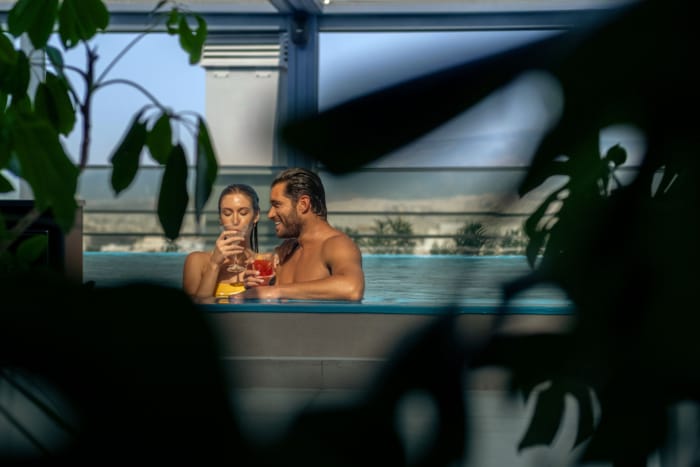 a person and person in a pool