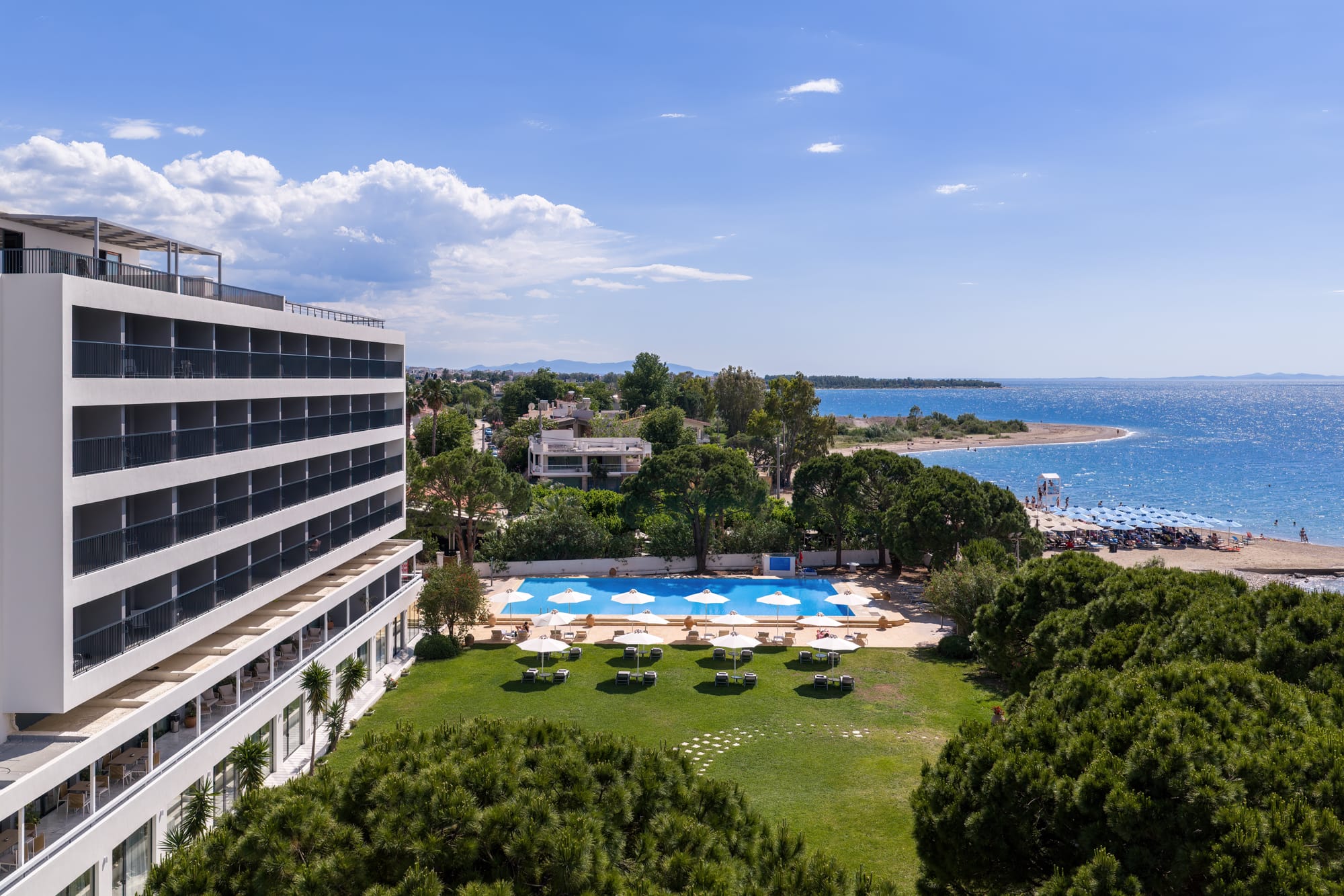 a large building with a pool in the middle of it