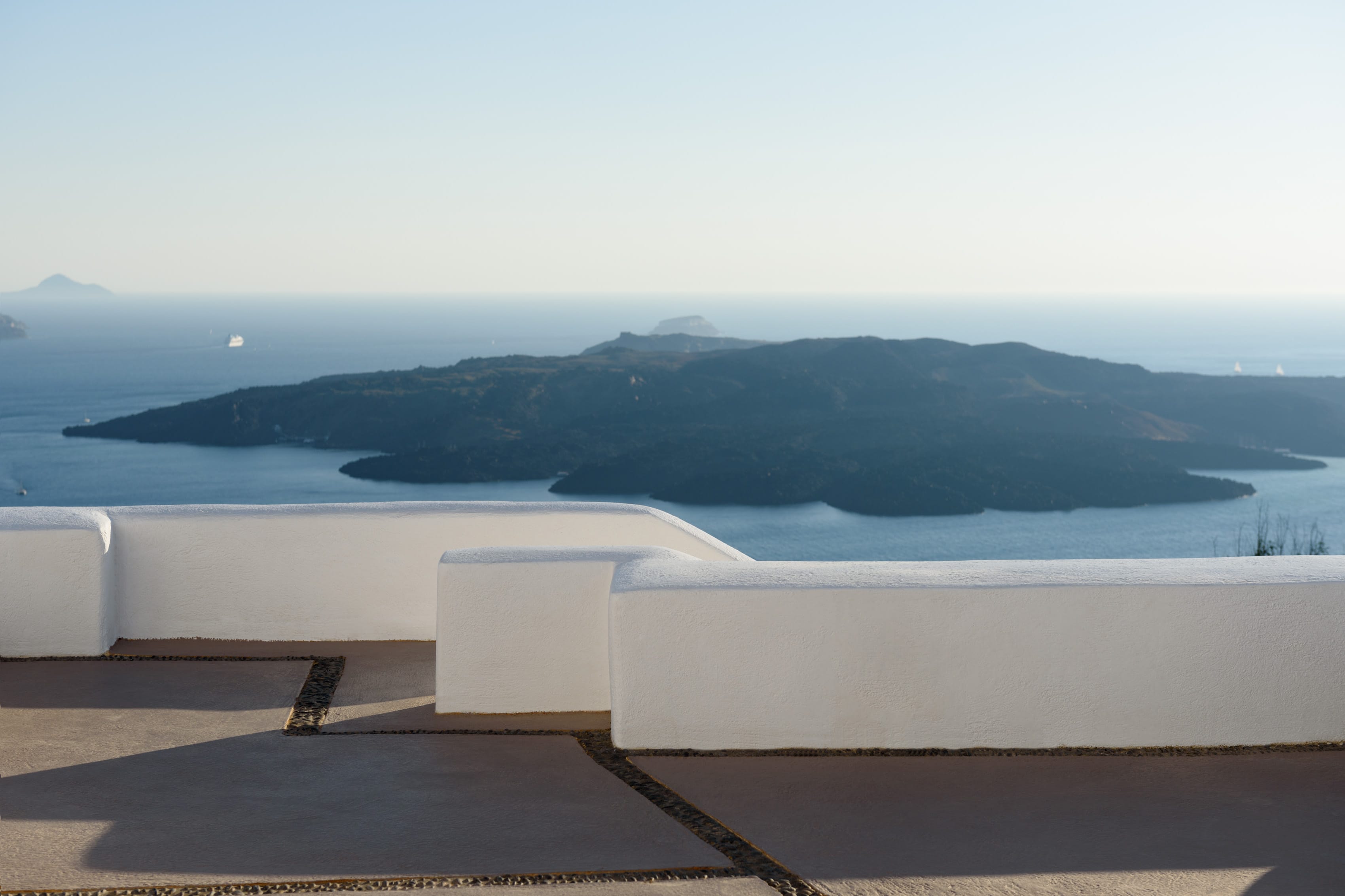 a white wall overlooking the ocean