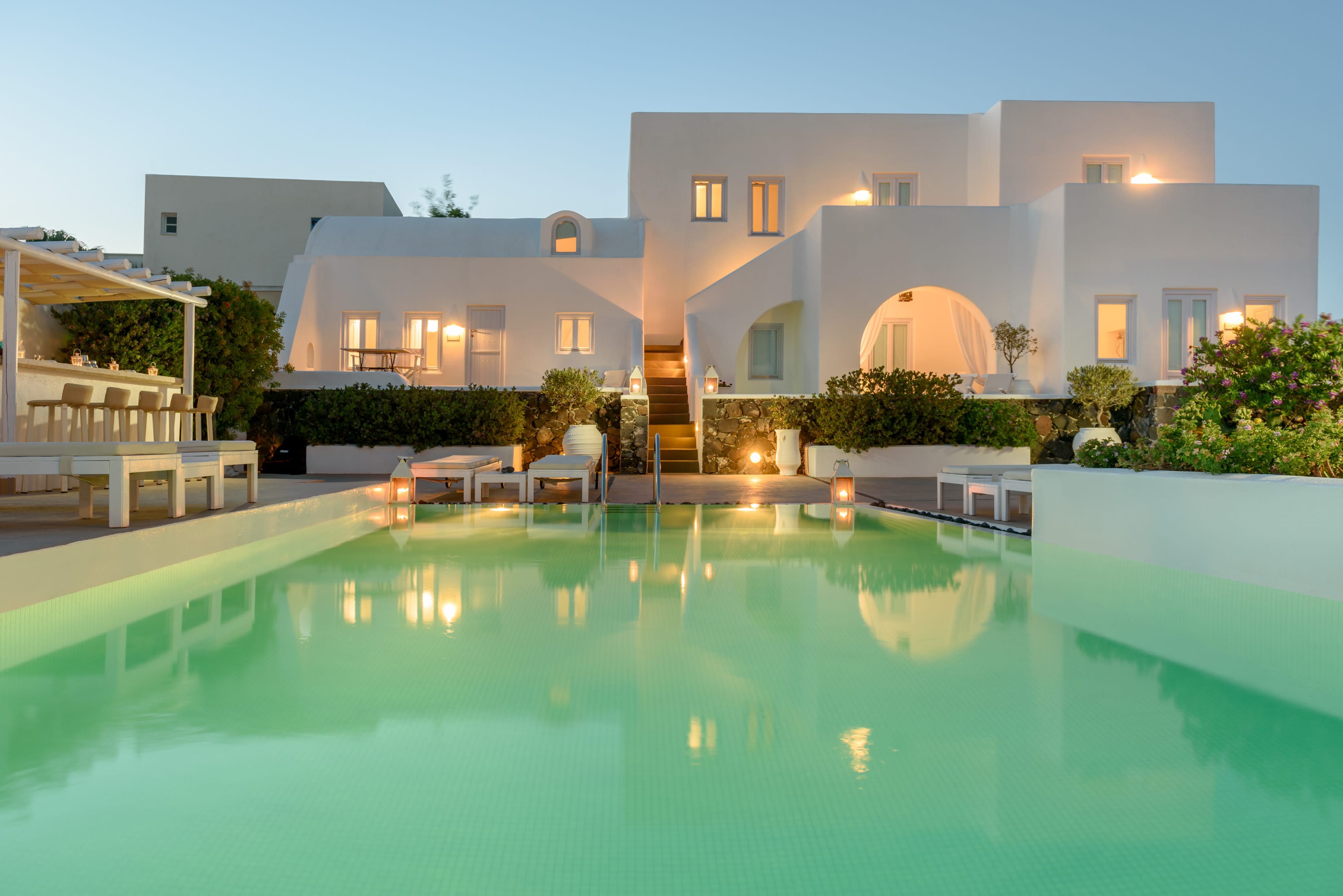 a pool with a building in the background