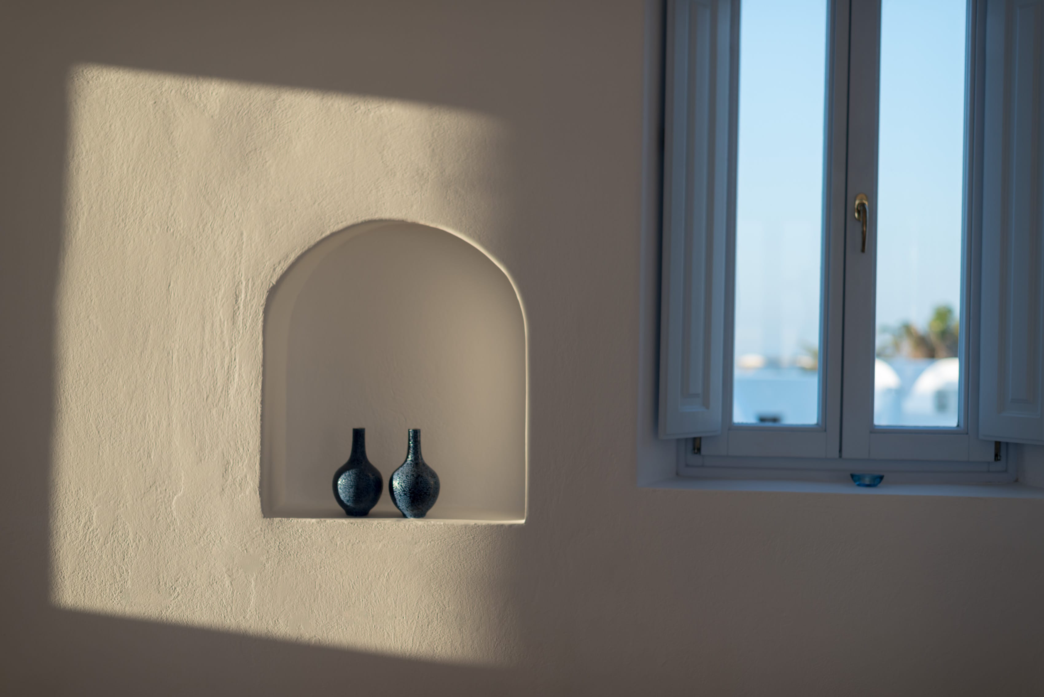 a shelf with vases on it