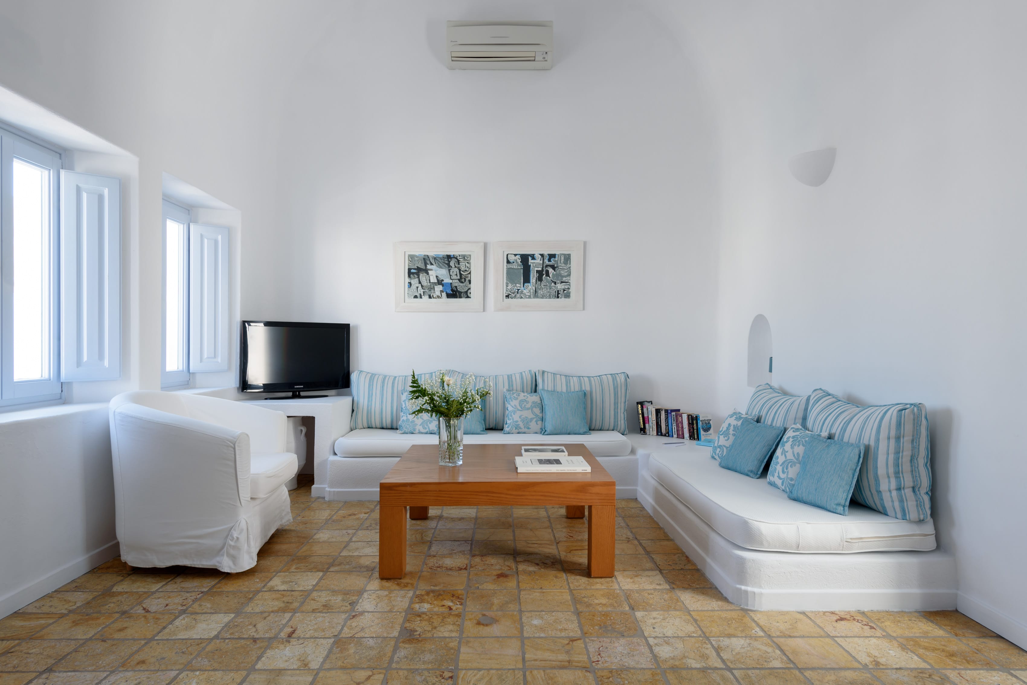 a living room with couches and a coffee table