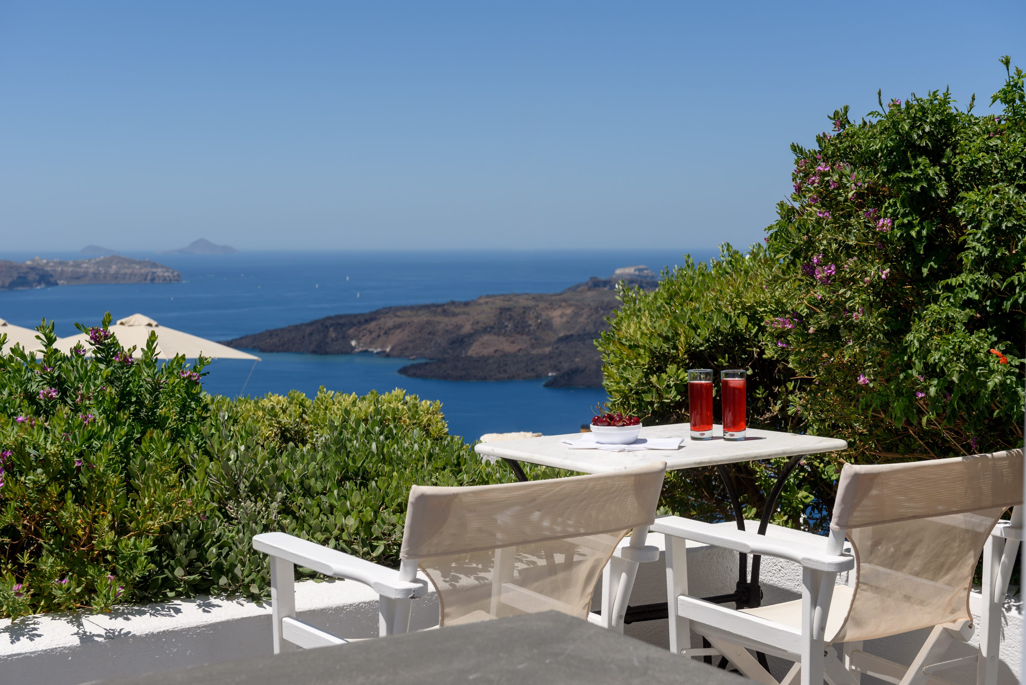 a table and chairs overlooking the ocean