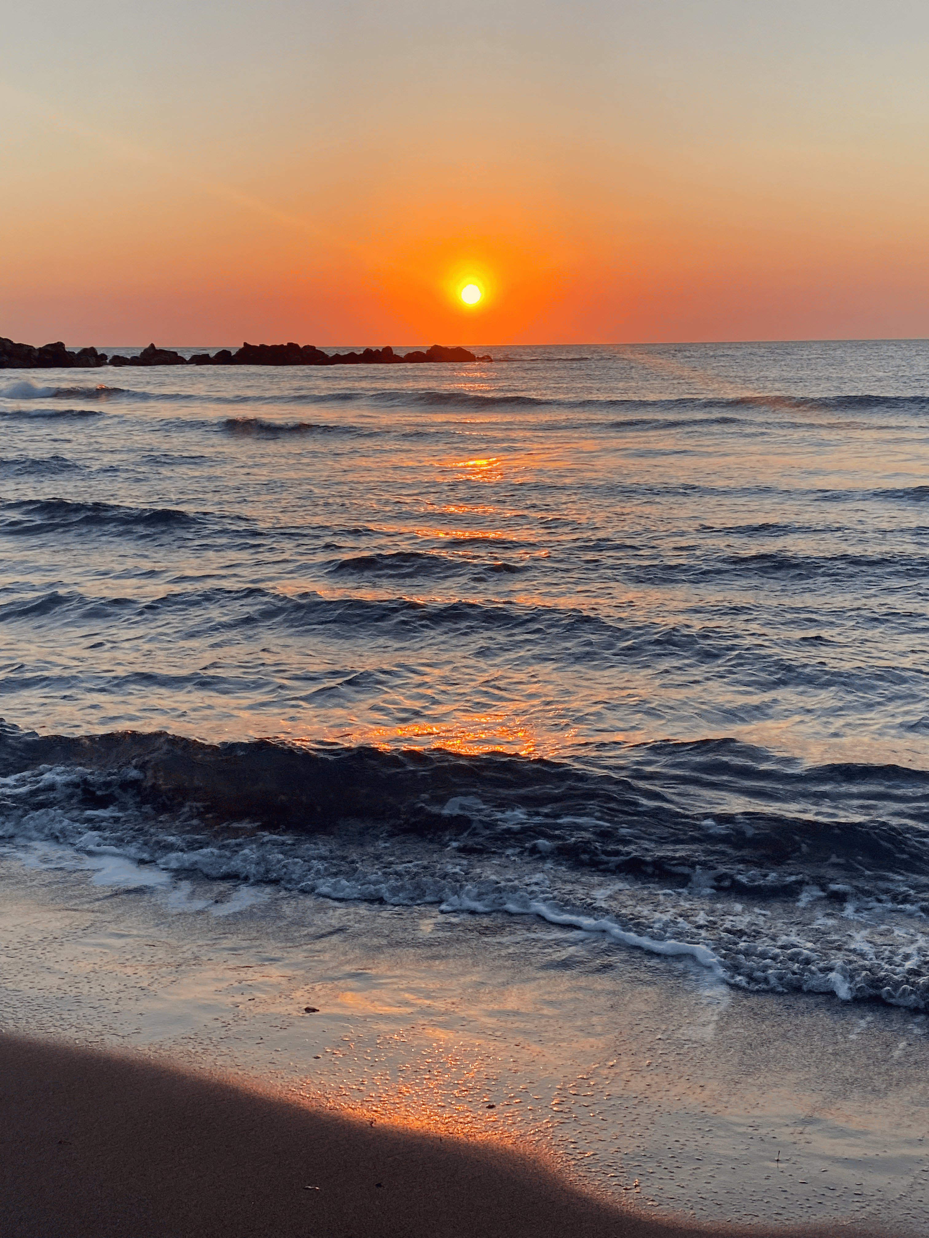 a sunset over a beach