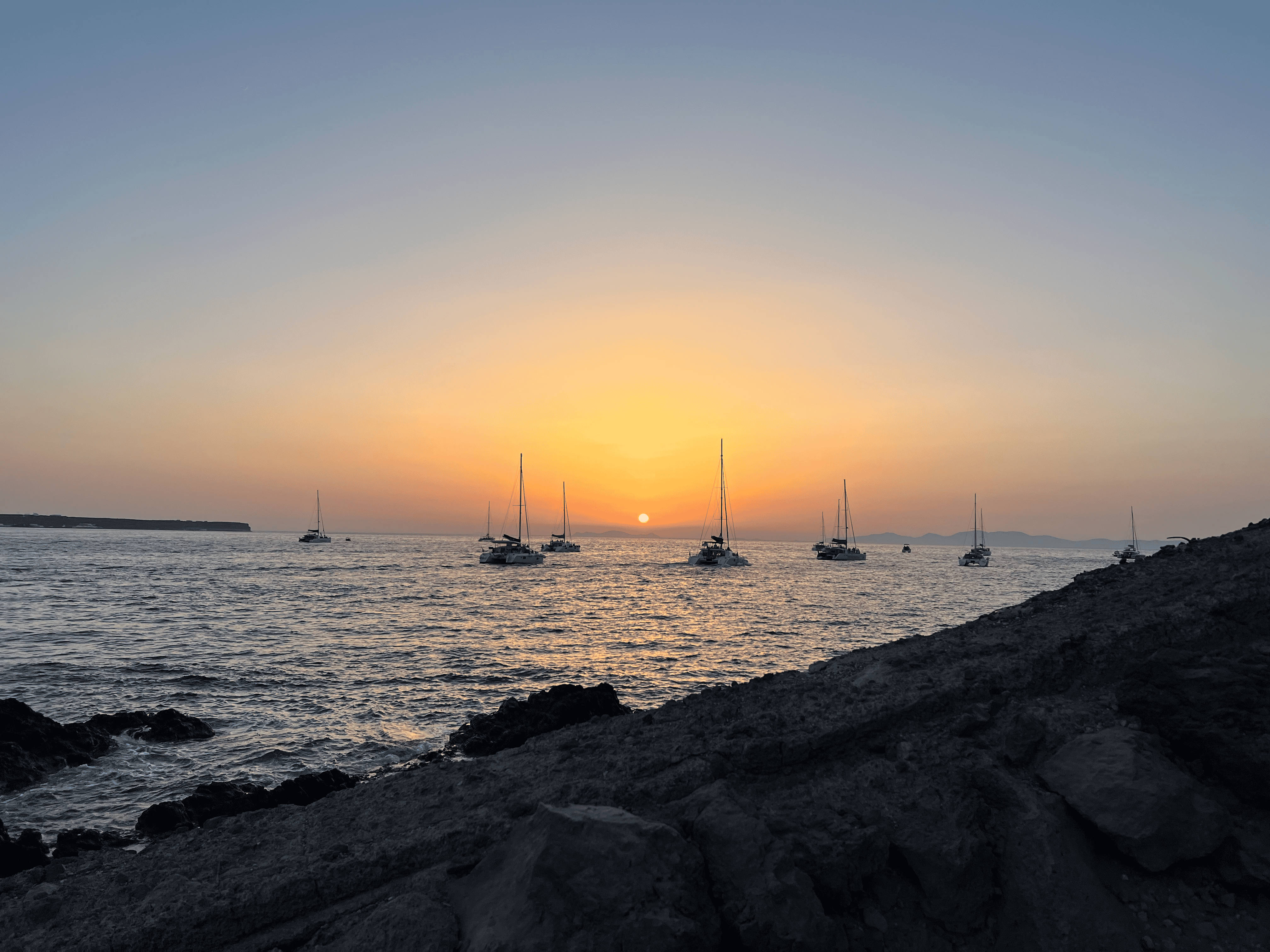 a sunset over a body of water