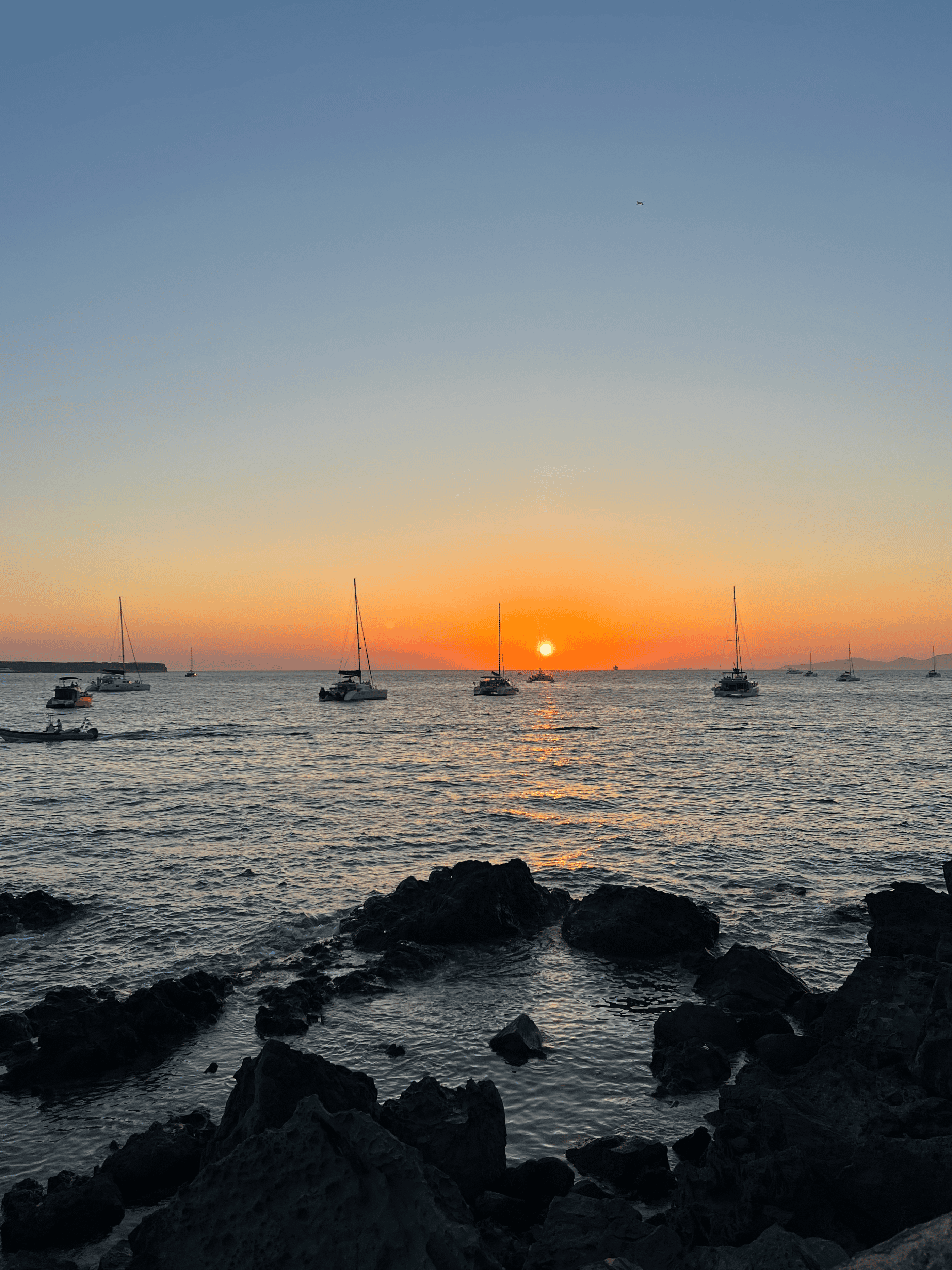 a sunset over a body of water