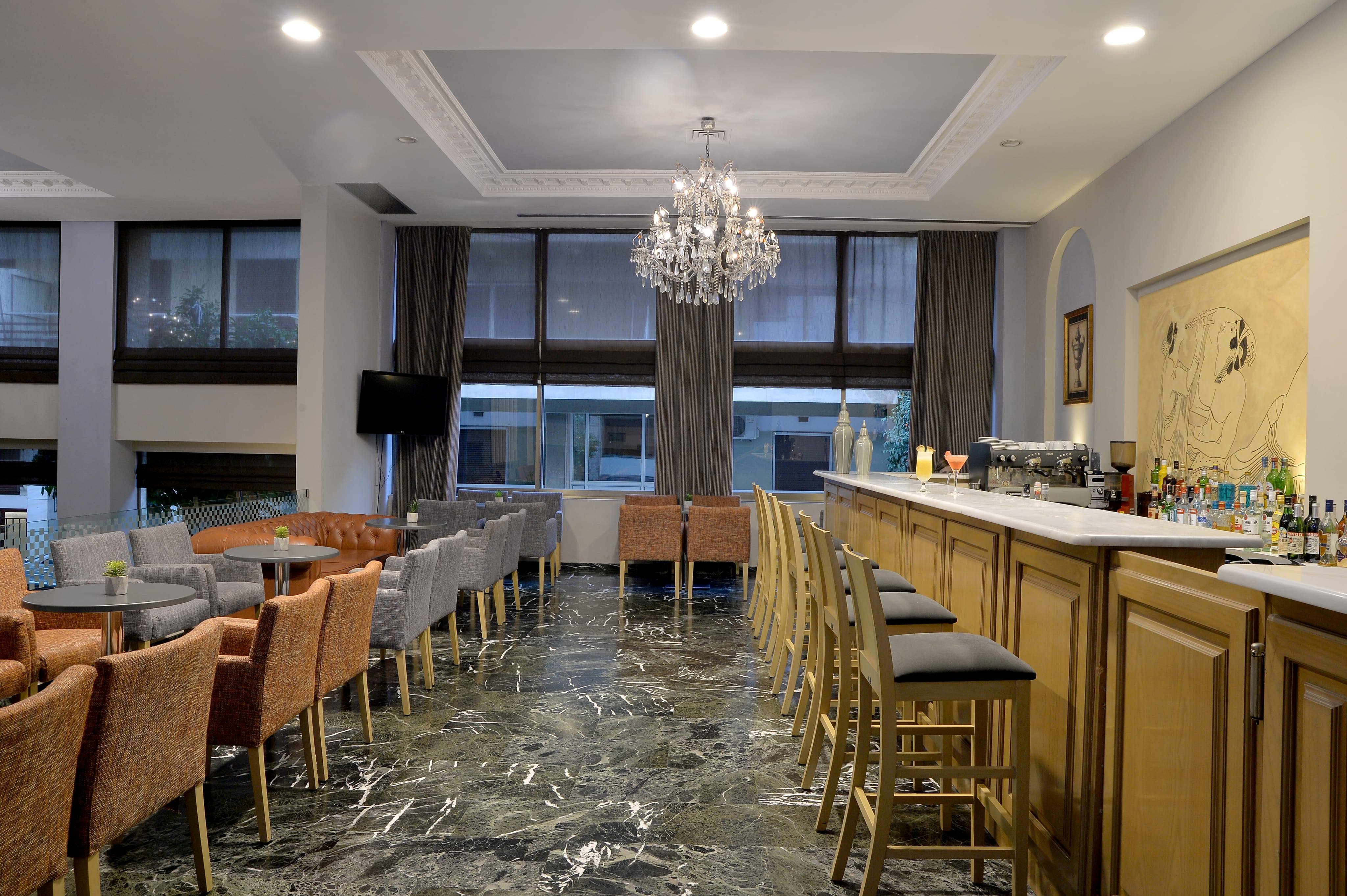 a room with chairs and a chandelier