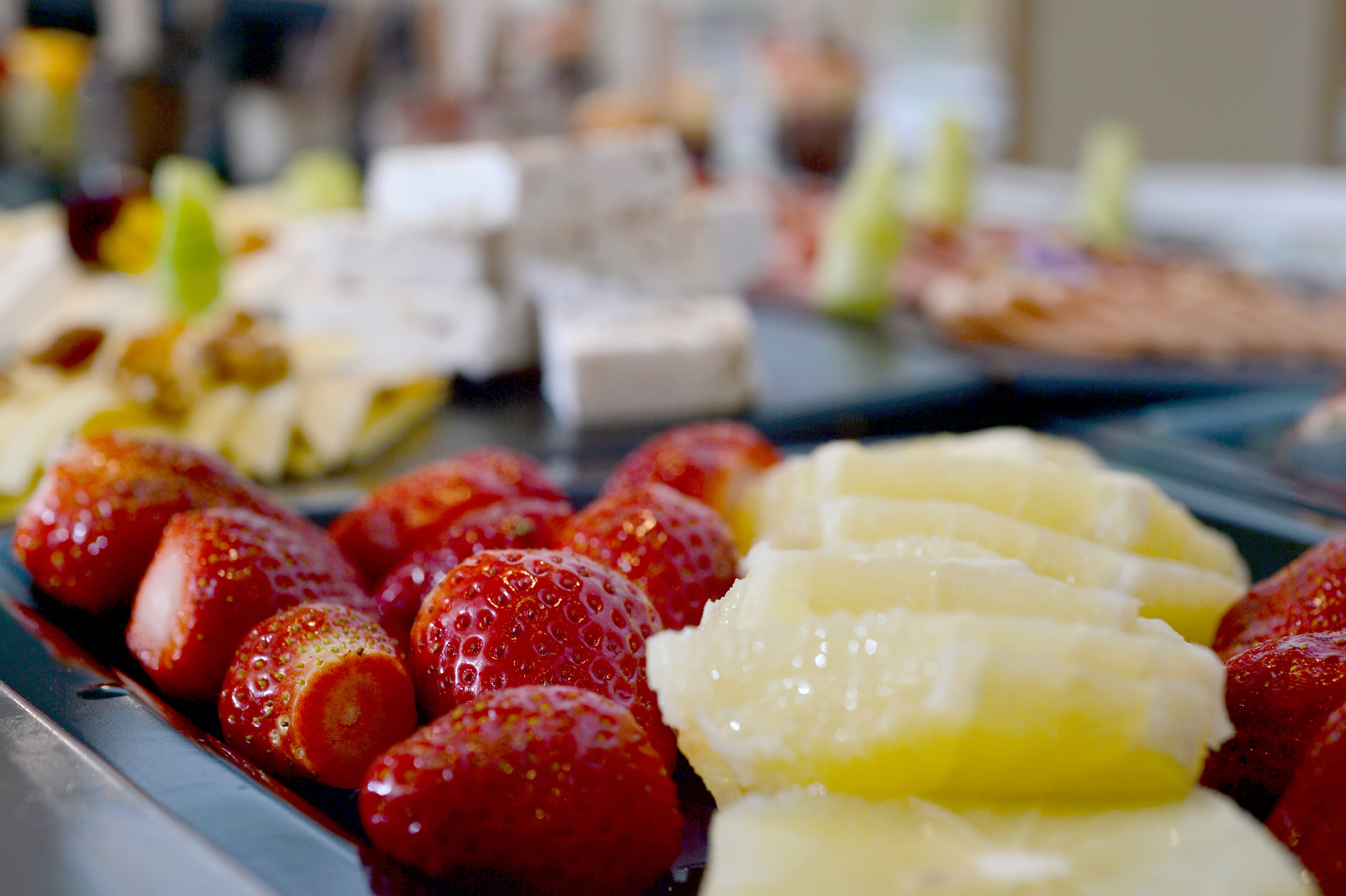 a plate of fruit and cheese