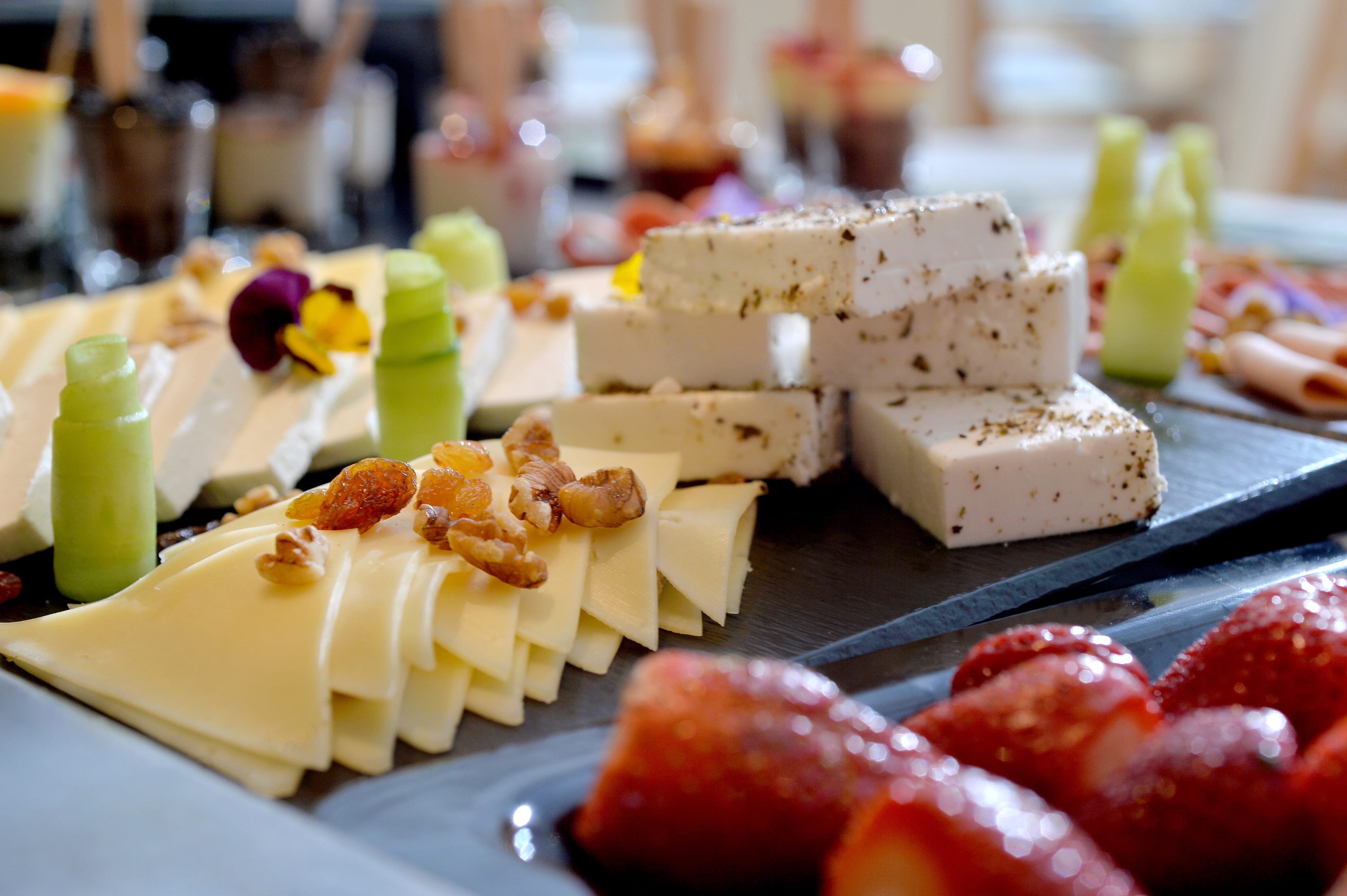 a plate of cheese and fruit