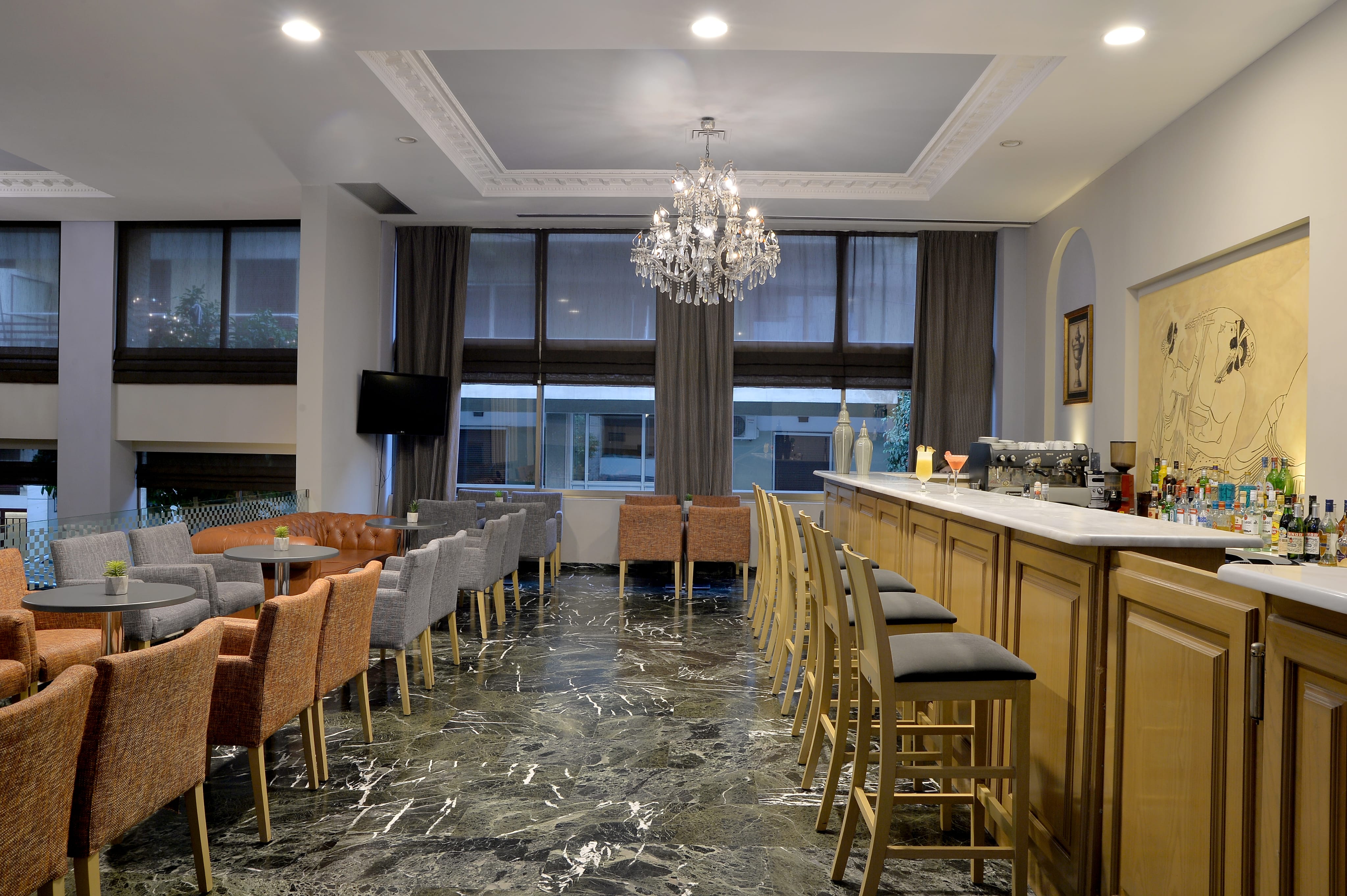 a room with chairs and a chandelier