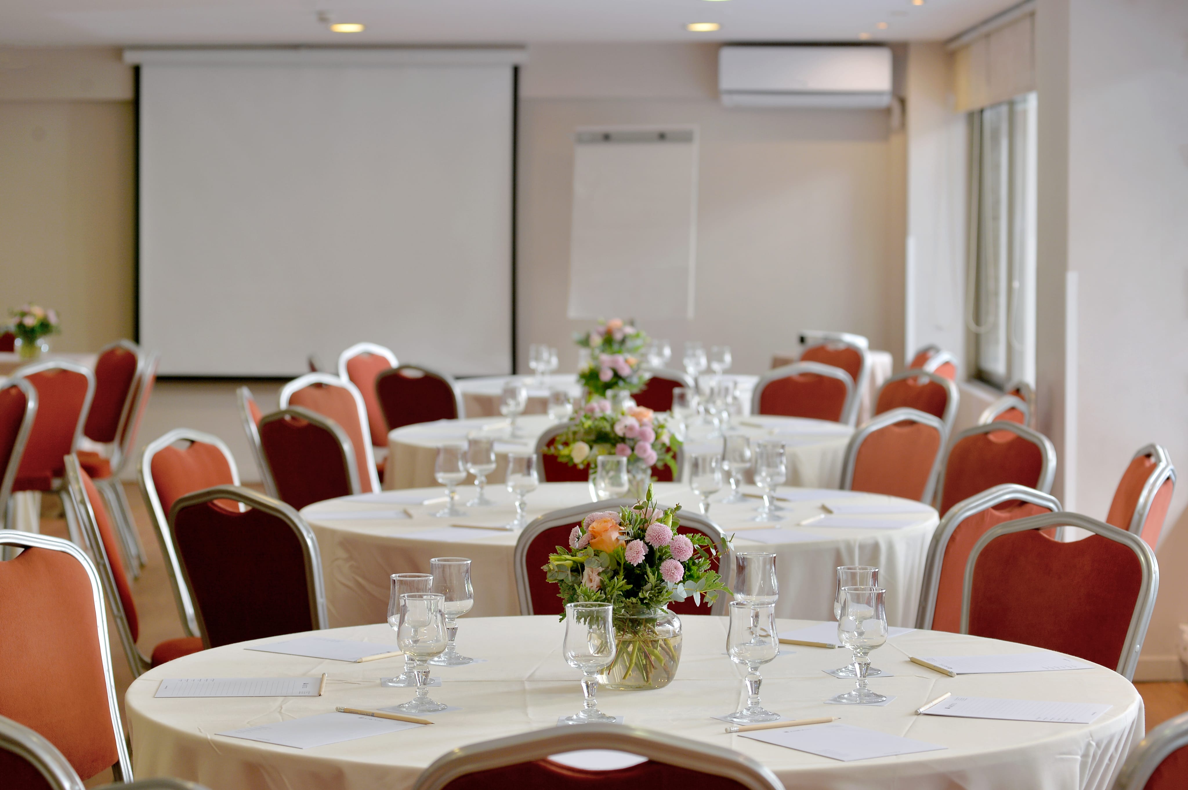 a room with tables and chairs