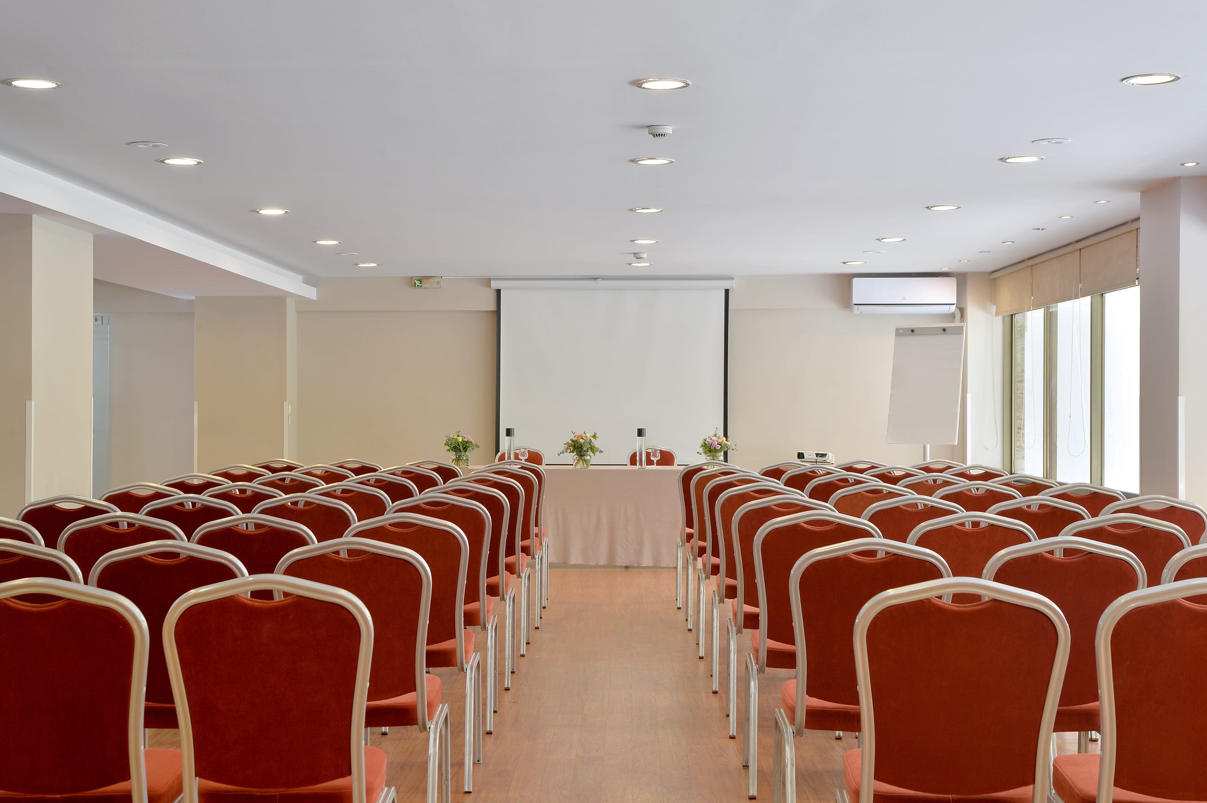 a room with red chairs