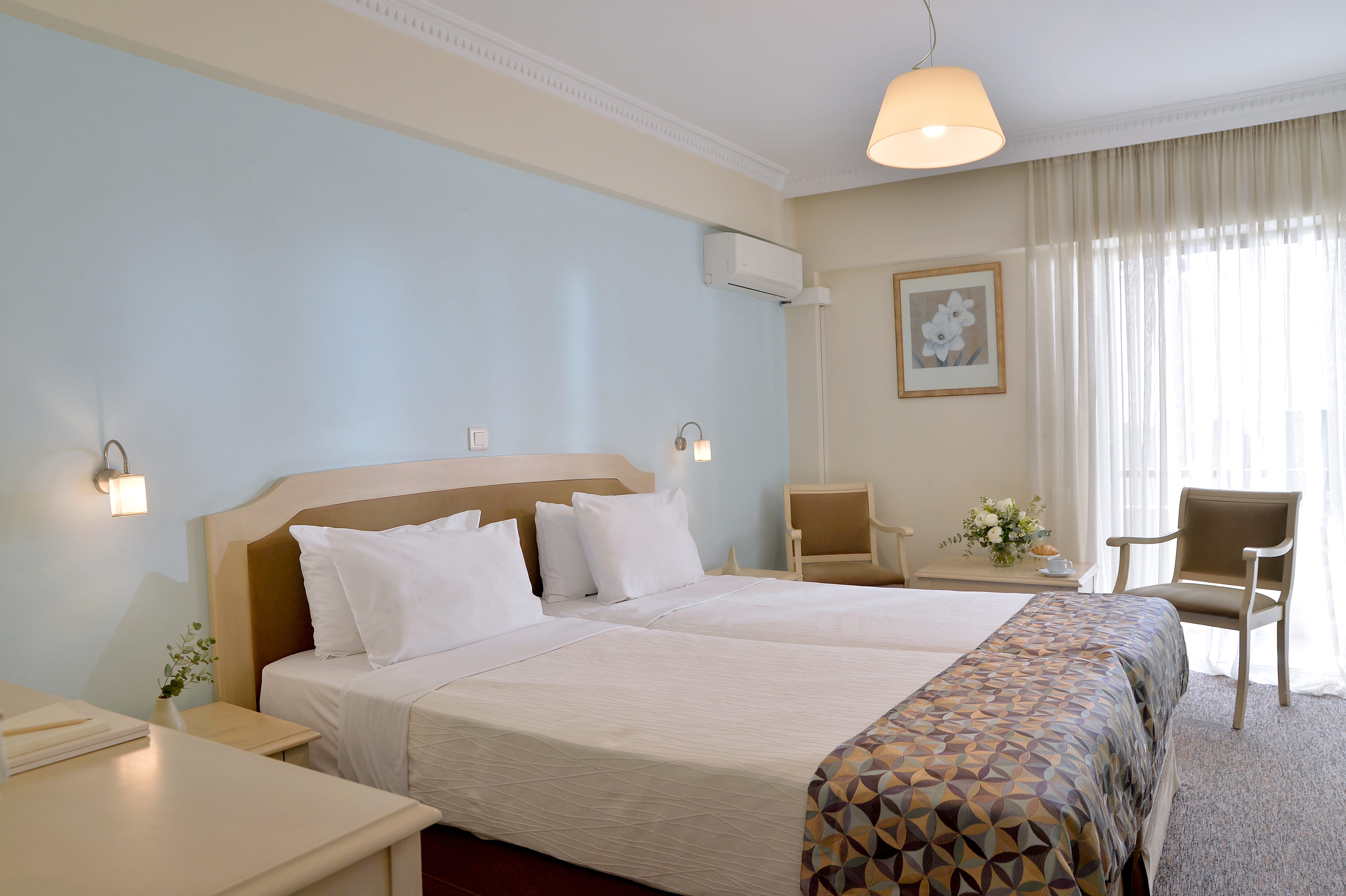 a hotel room with two beds