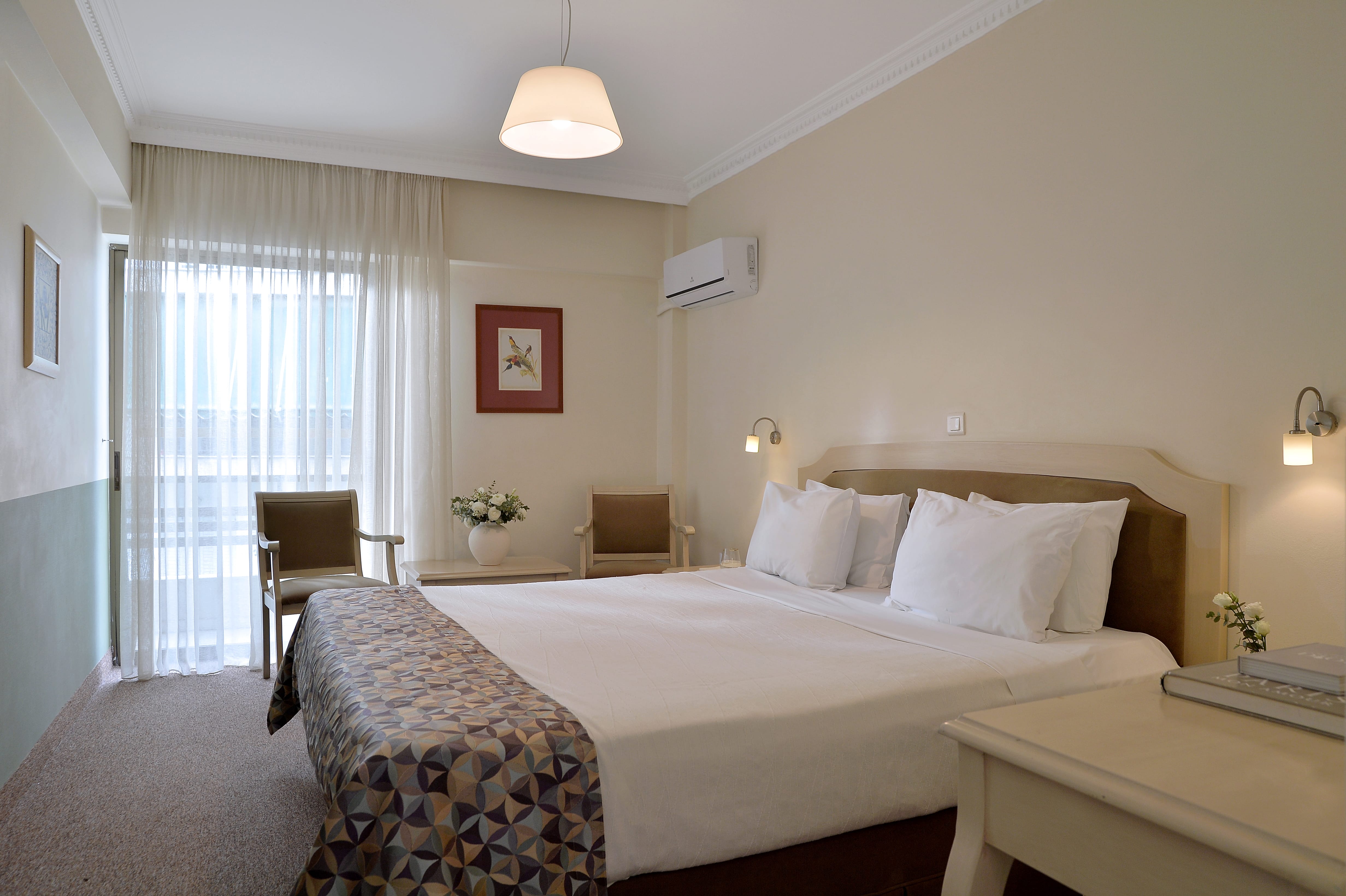a hotel room with a bed and a table
