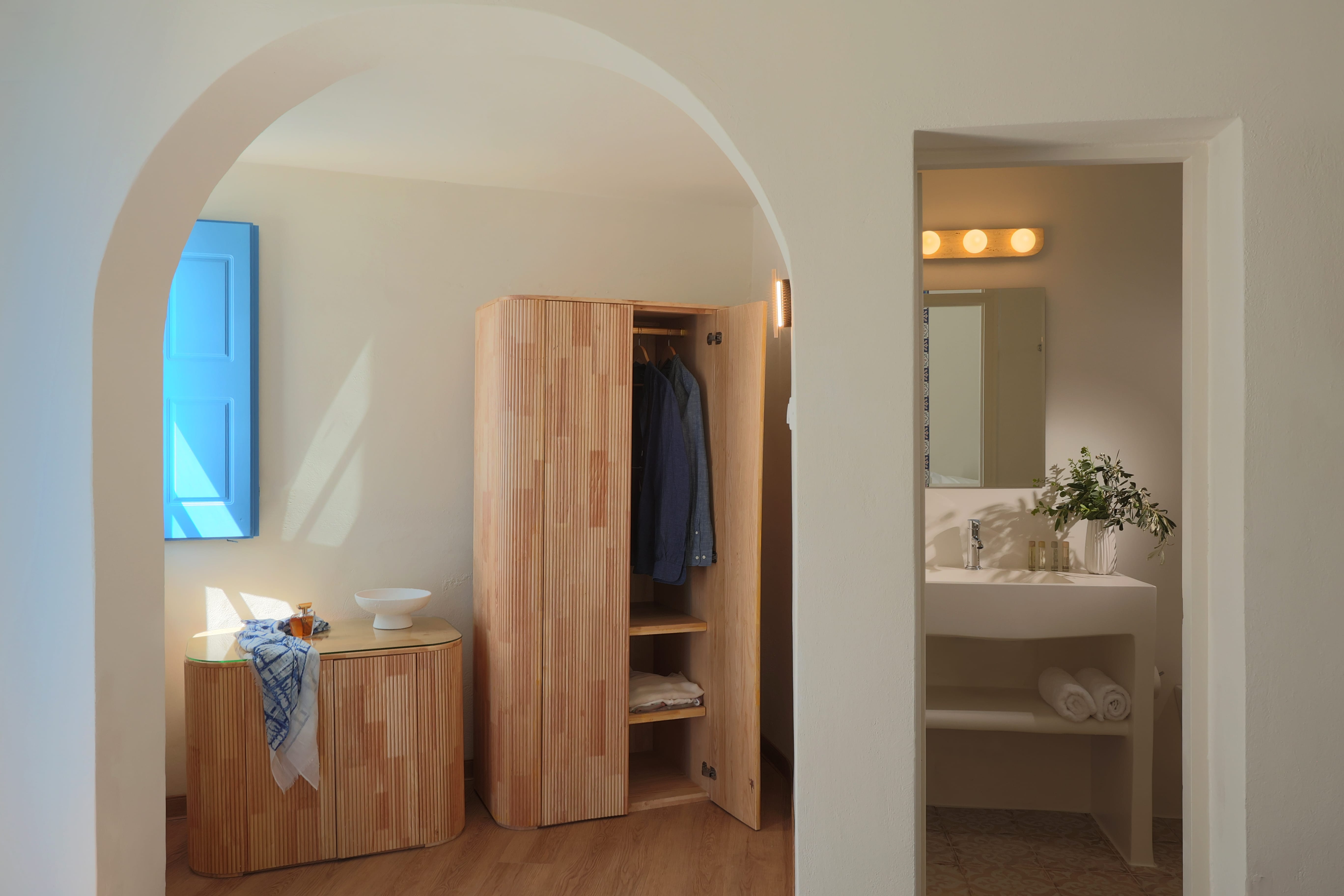 a room with a closet and sink
